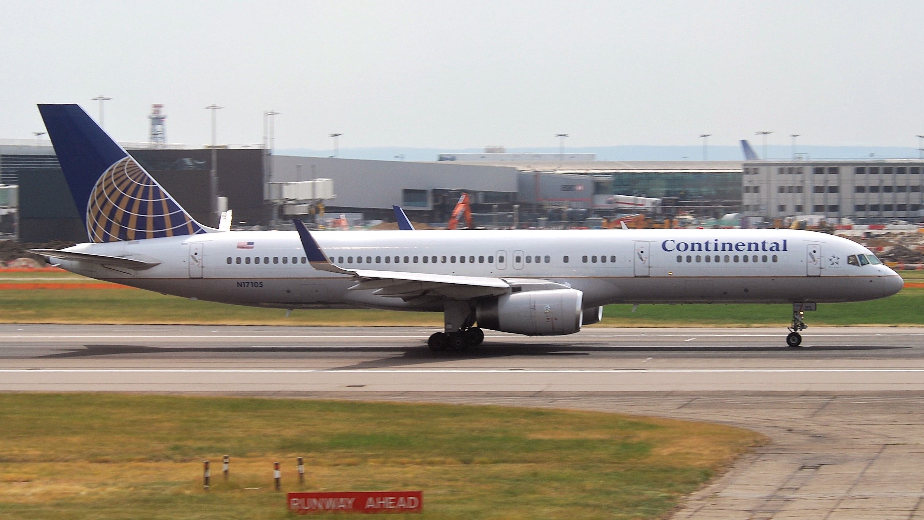 A Continental Airlines Boeing 757 on a runway At London Heathrow Airport.