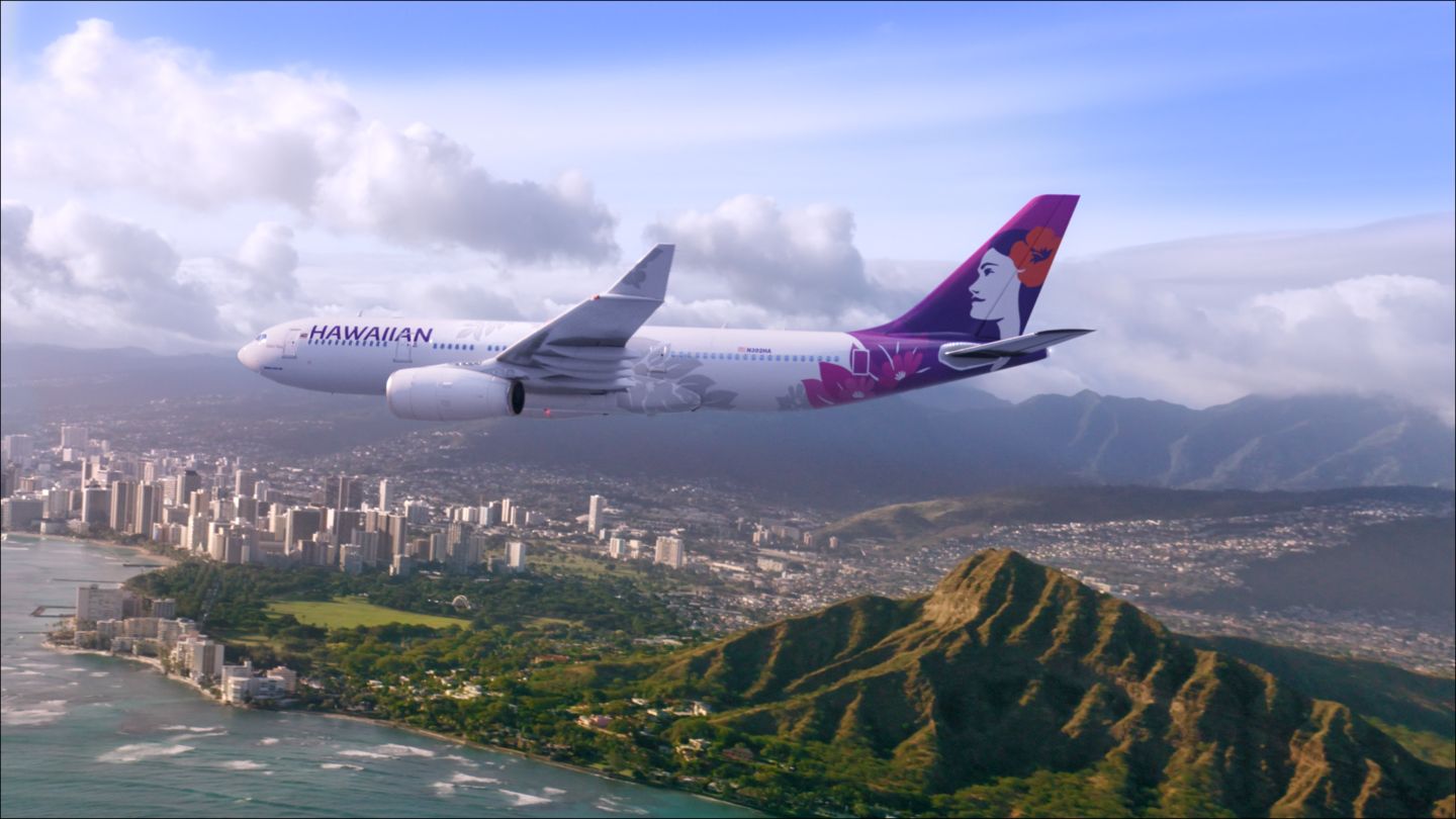 A Hawaiian Airlines Airbus A330 flying over Honolulu.