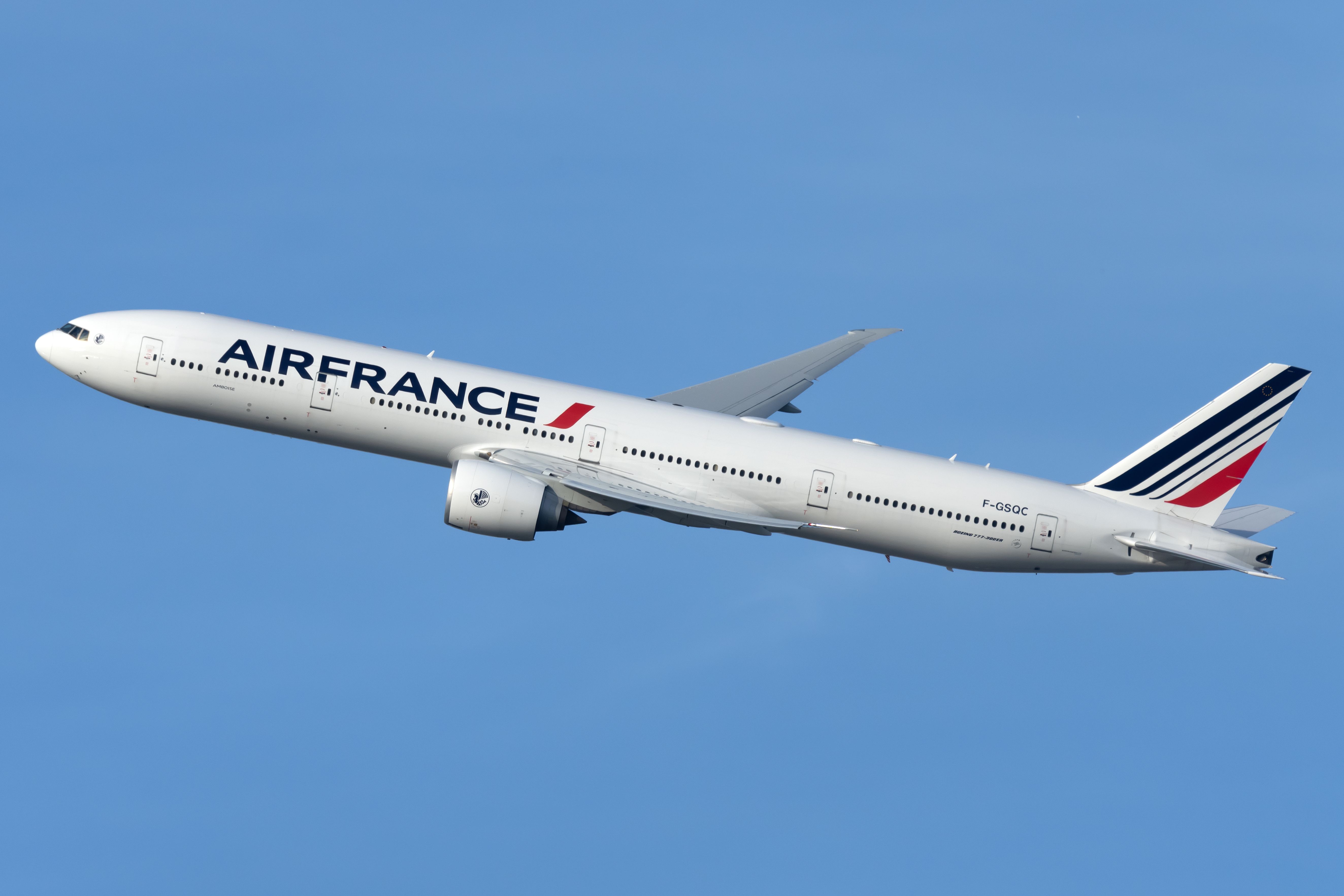 An Air France Boeing 777-300er flying in the sky.