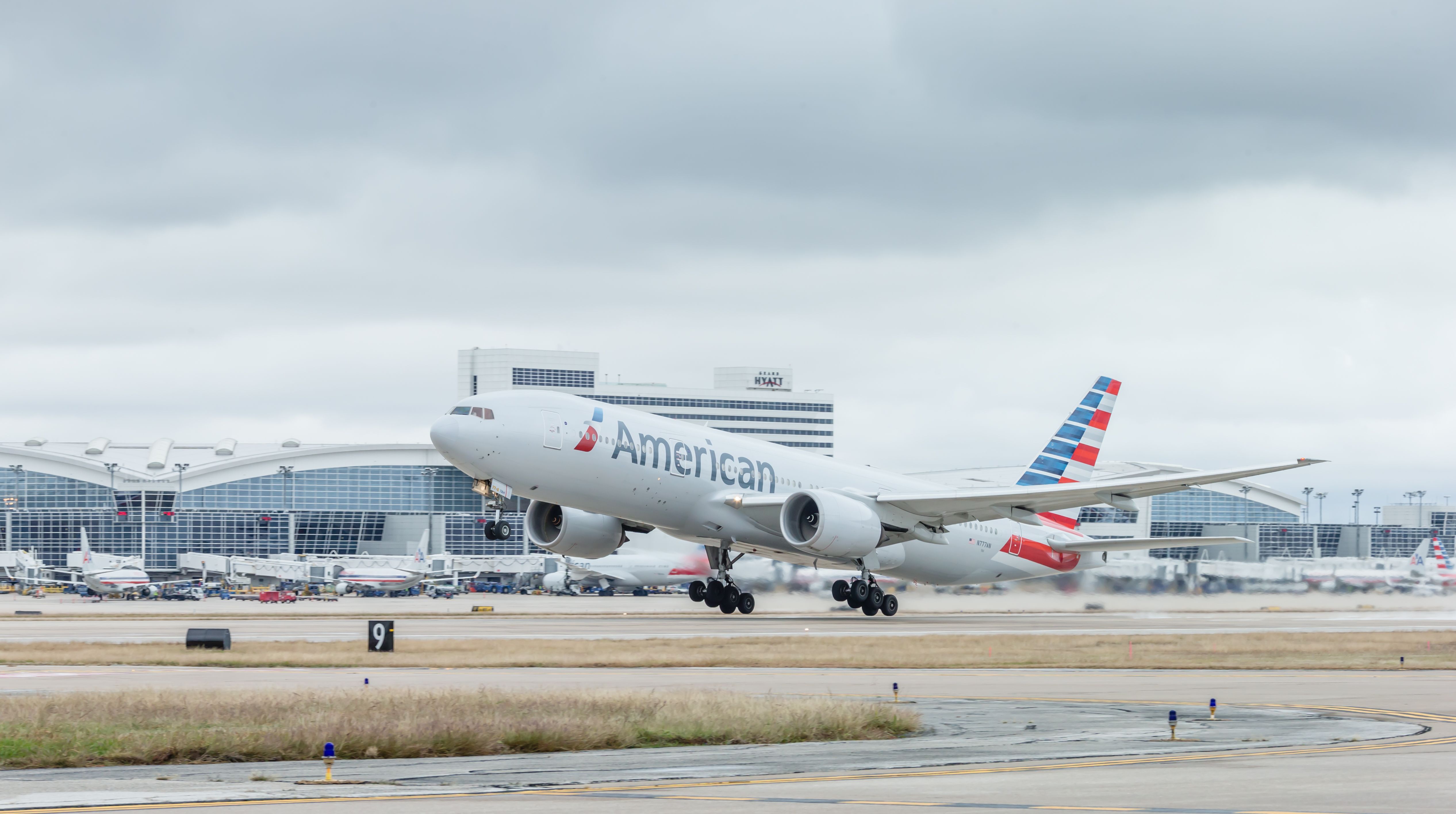 American Airlines Boeing 777-323/ER taking off from Dallas/Fort Worth International Airport. 