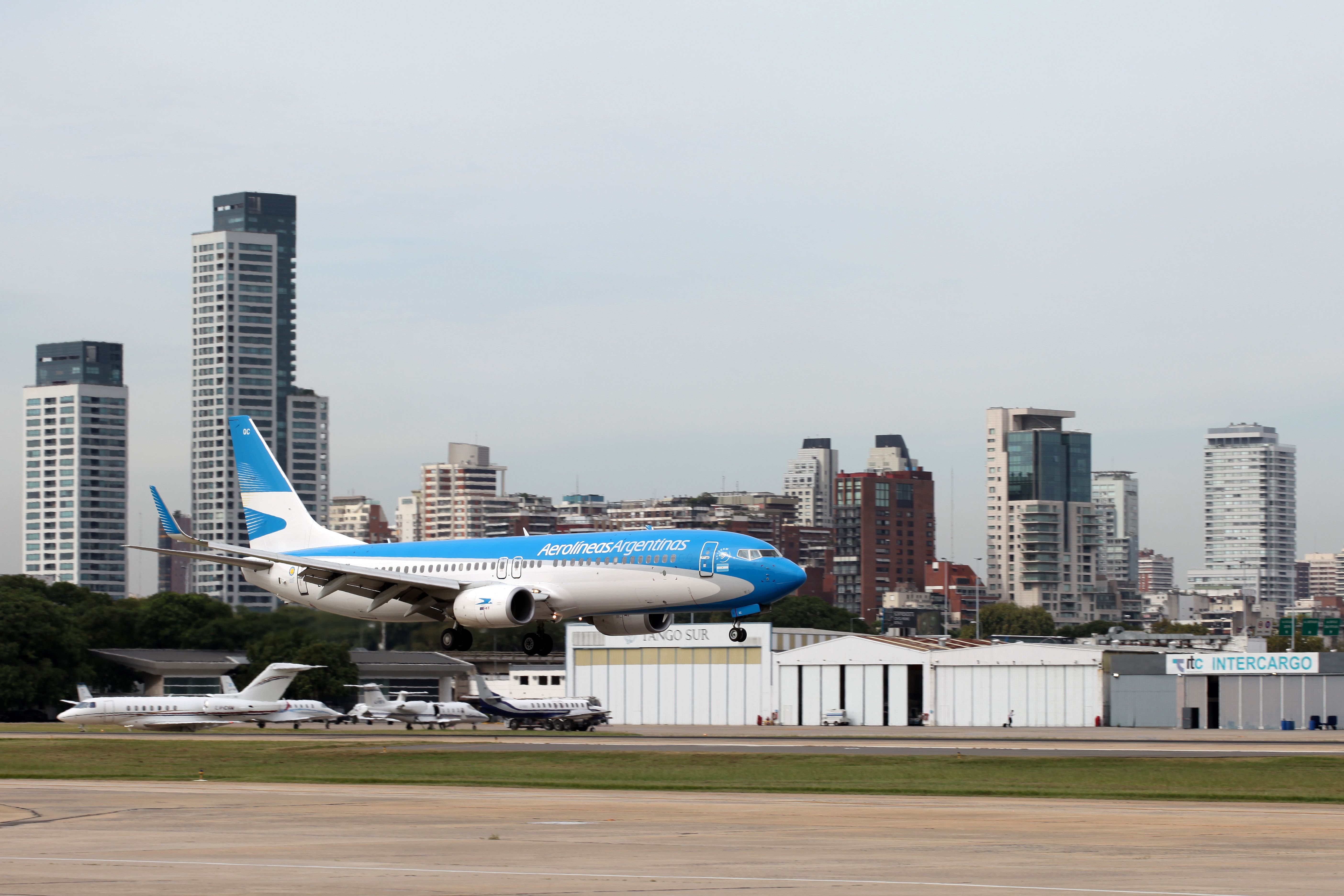 An Aerolíneas Argentinas airplane about to land on a runway.