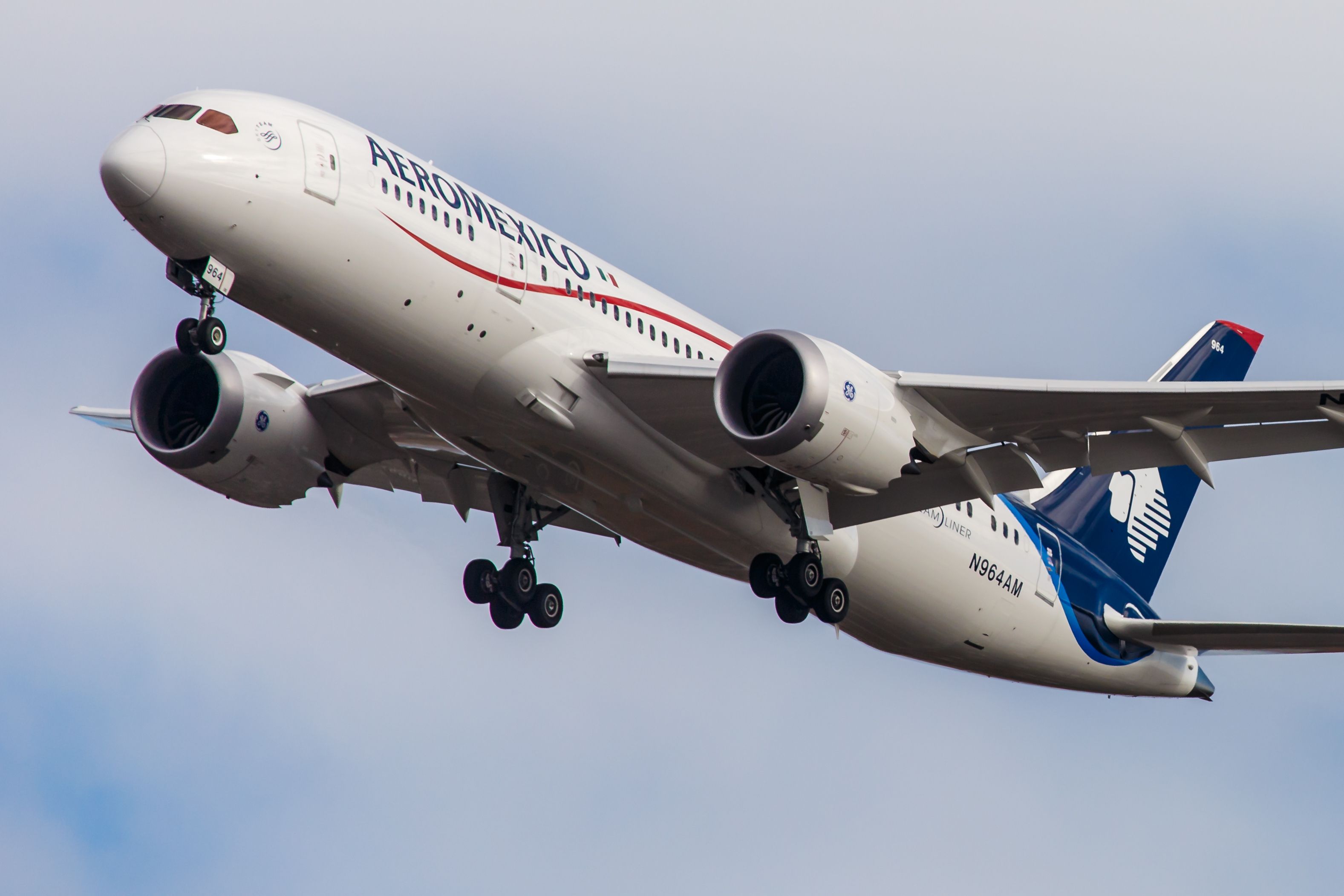 An Aeromexico Boeing 787 flying in the sky.
