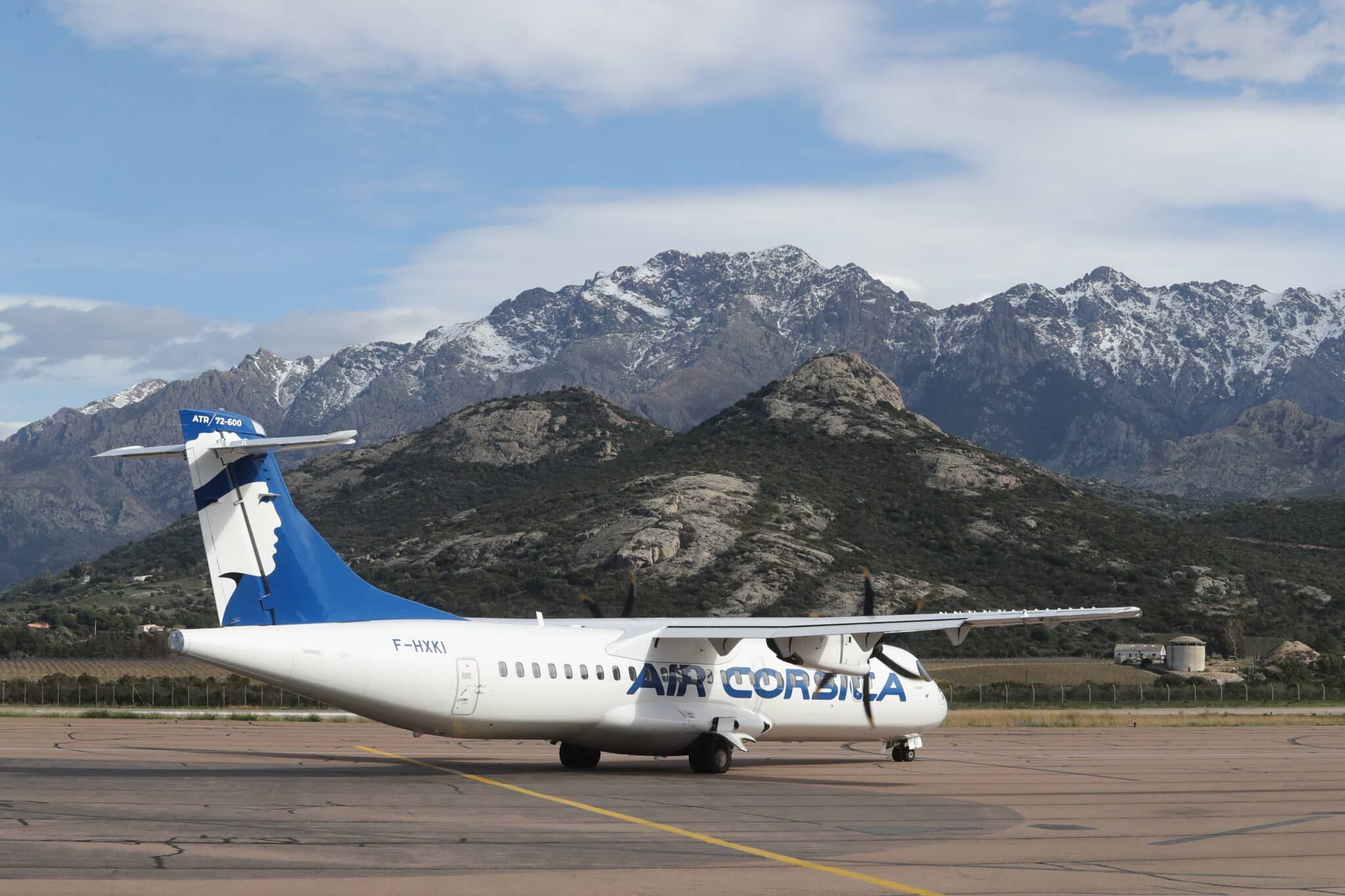 An Air Corsica ATR aircraft against a mountainous landscape 