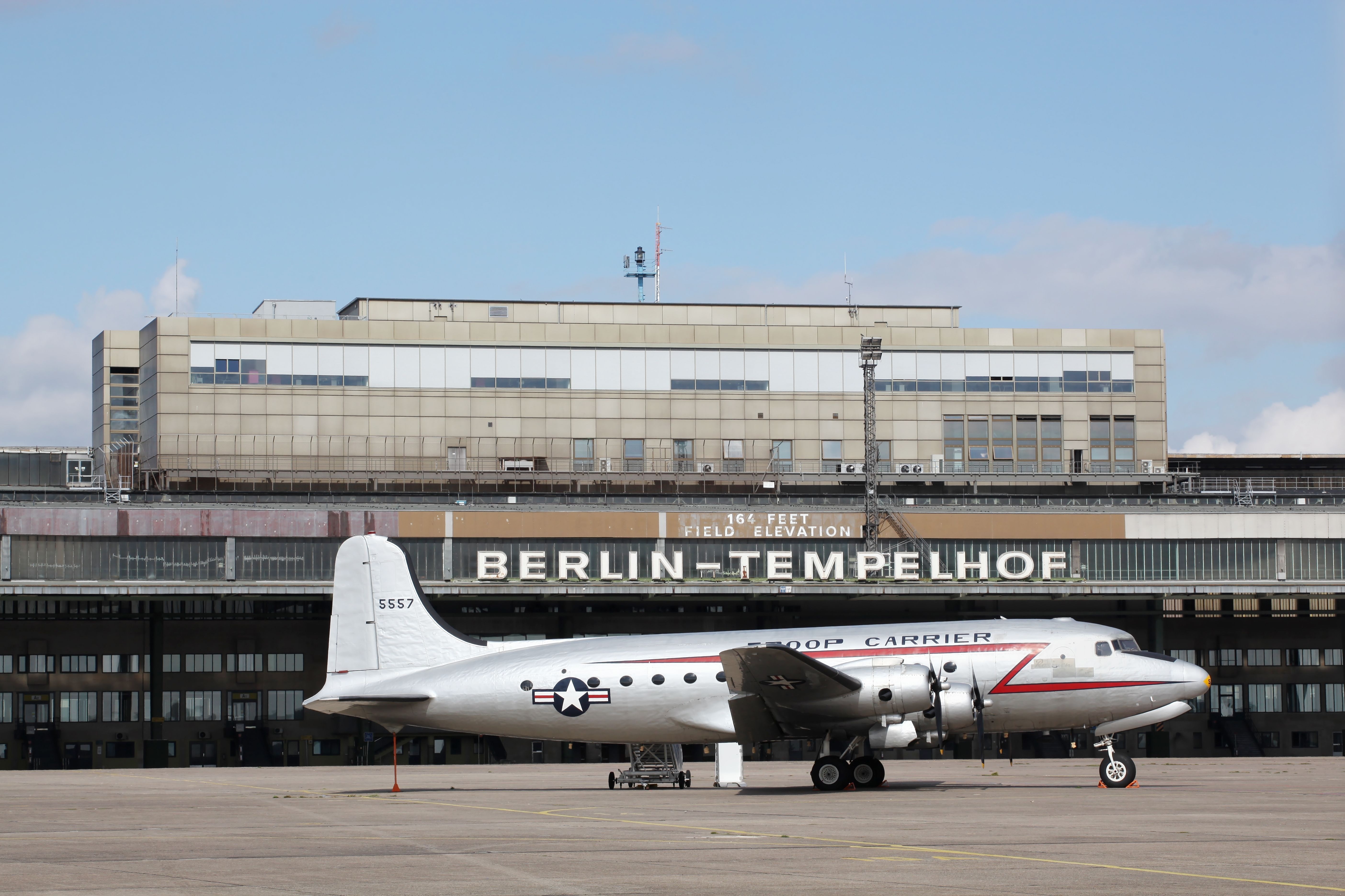An aircraft from World War II parked in fornt of Berlin Tempelhof Airport.
