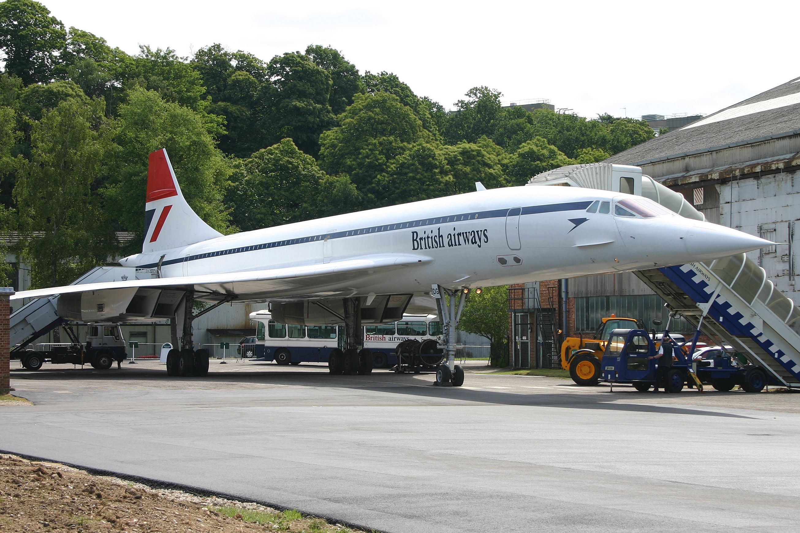 A British Airways Concorde aircraft parked on an airport apron.