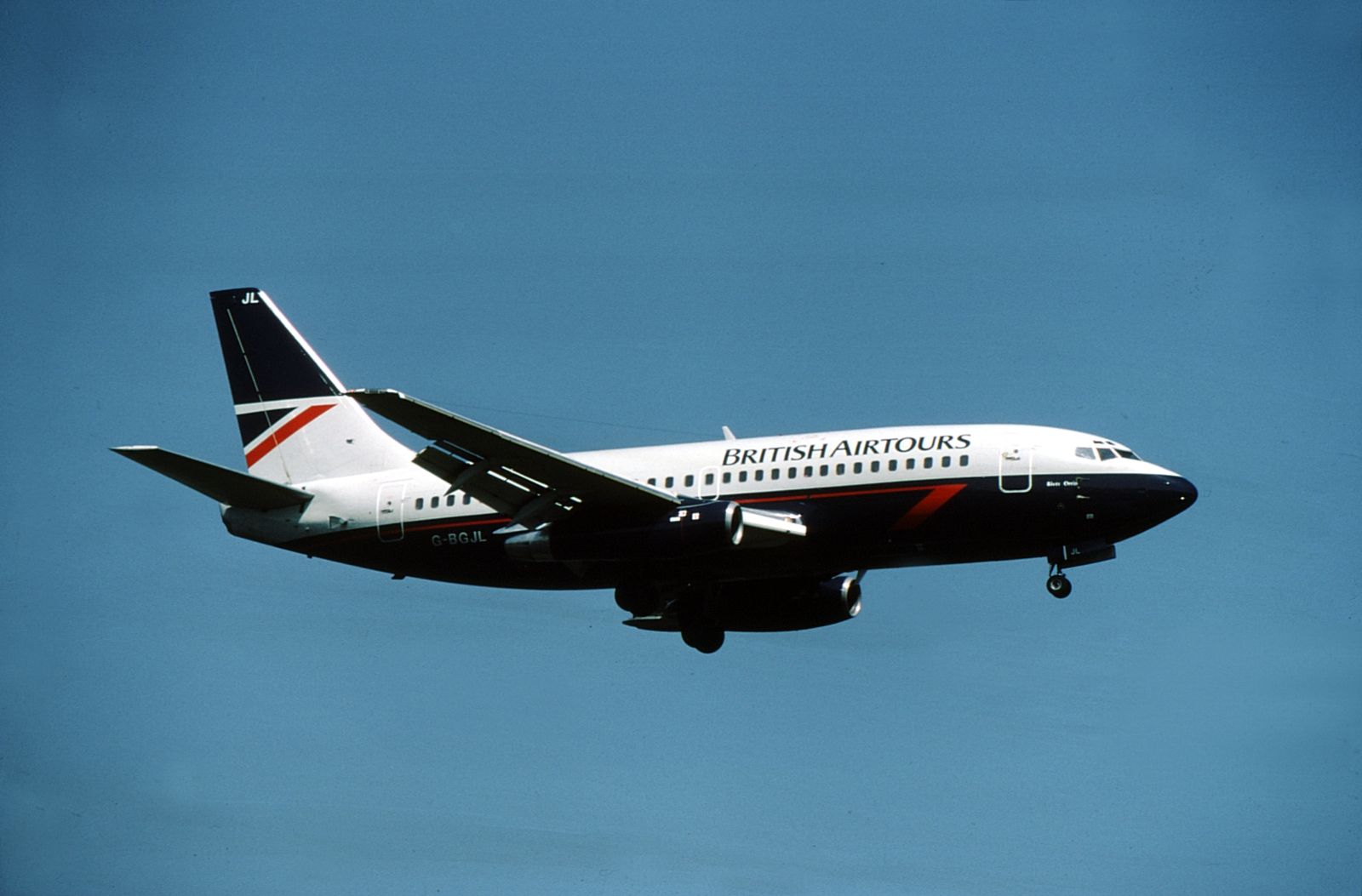 A British Airtours Boeing 737 flying in the sky.
