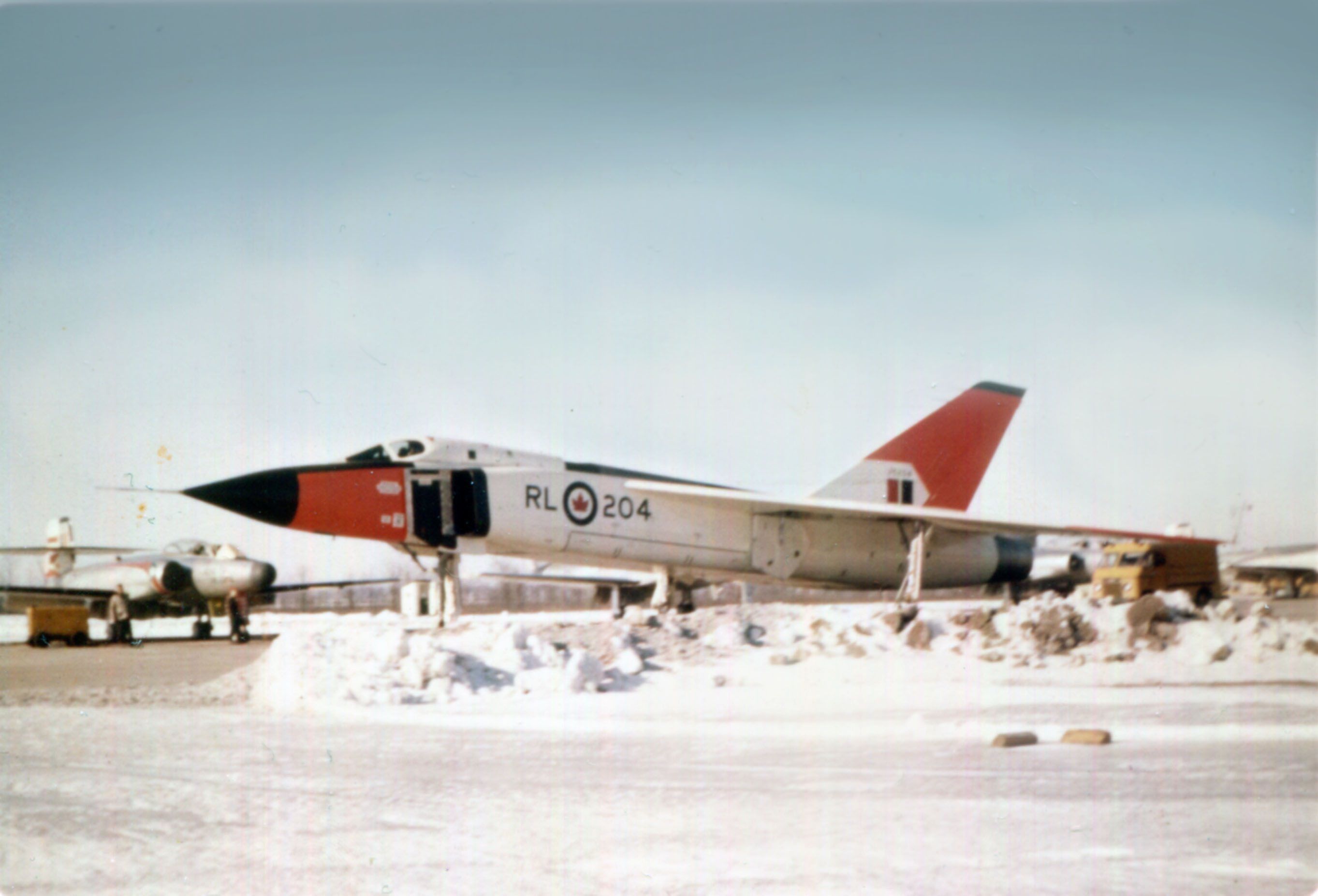 An Avro Canada CF-105 on a snowy airport apron.