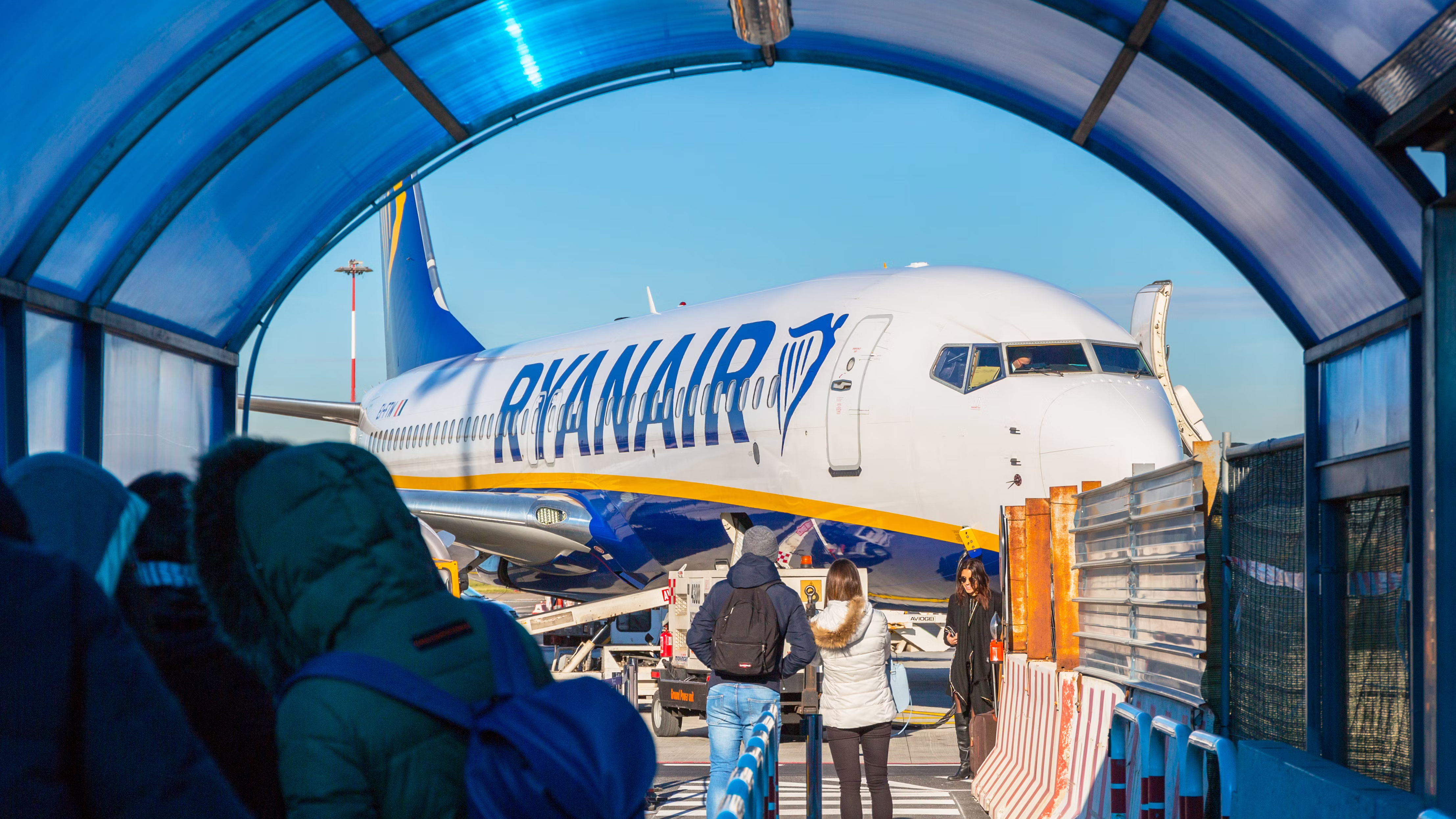 People wait to board a Ryanair flight at Rome Ciampino Airport.