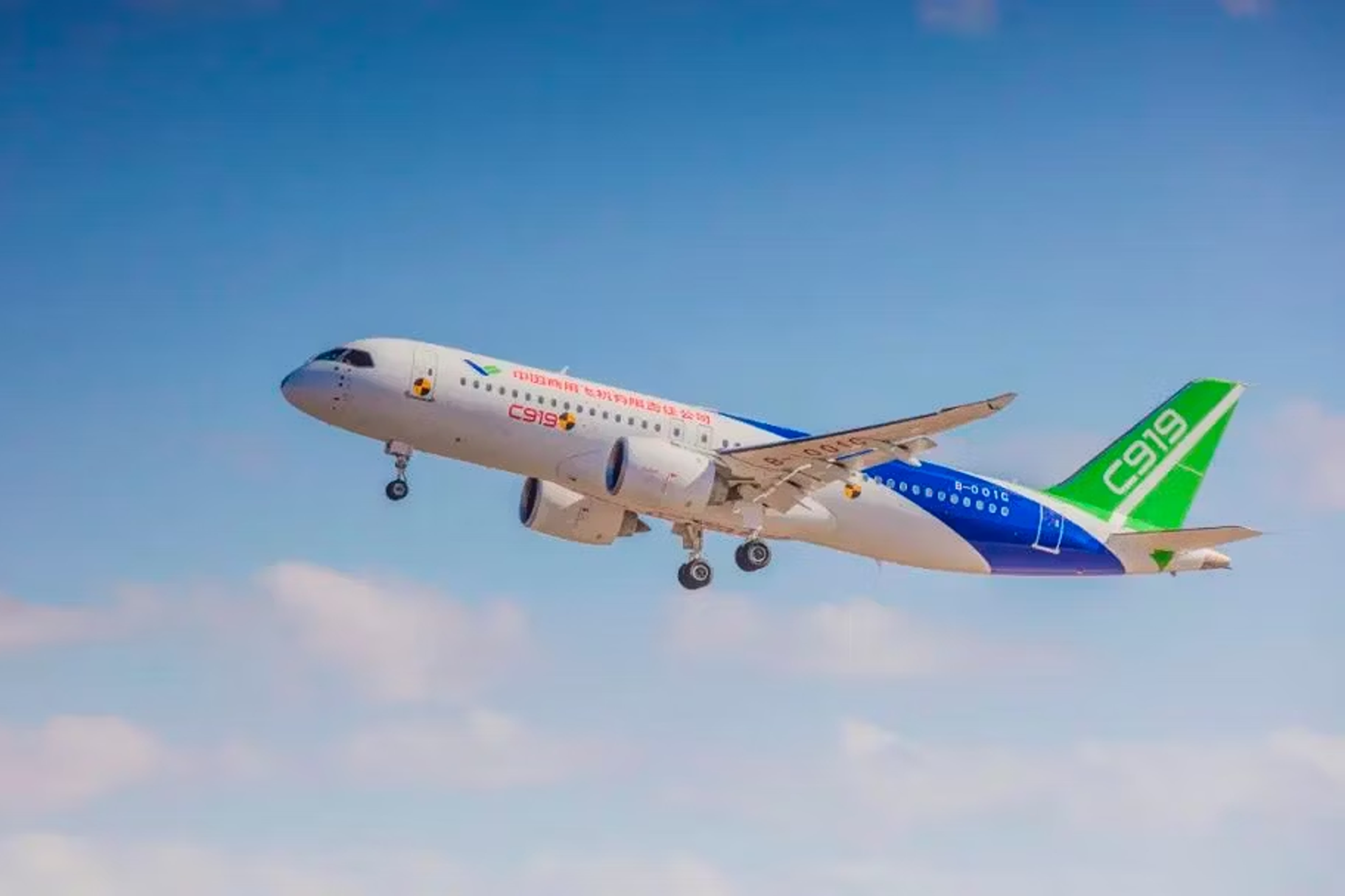comac c919 taking off into a blue sky