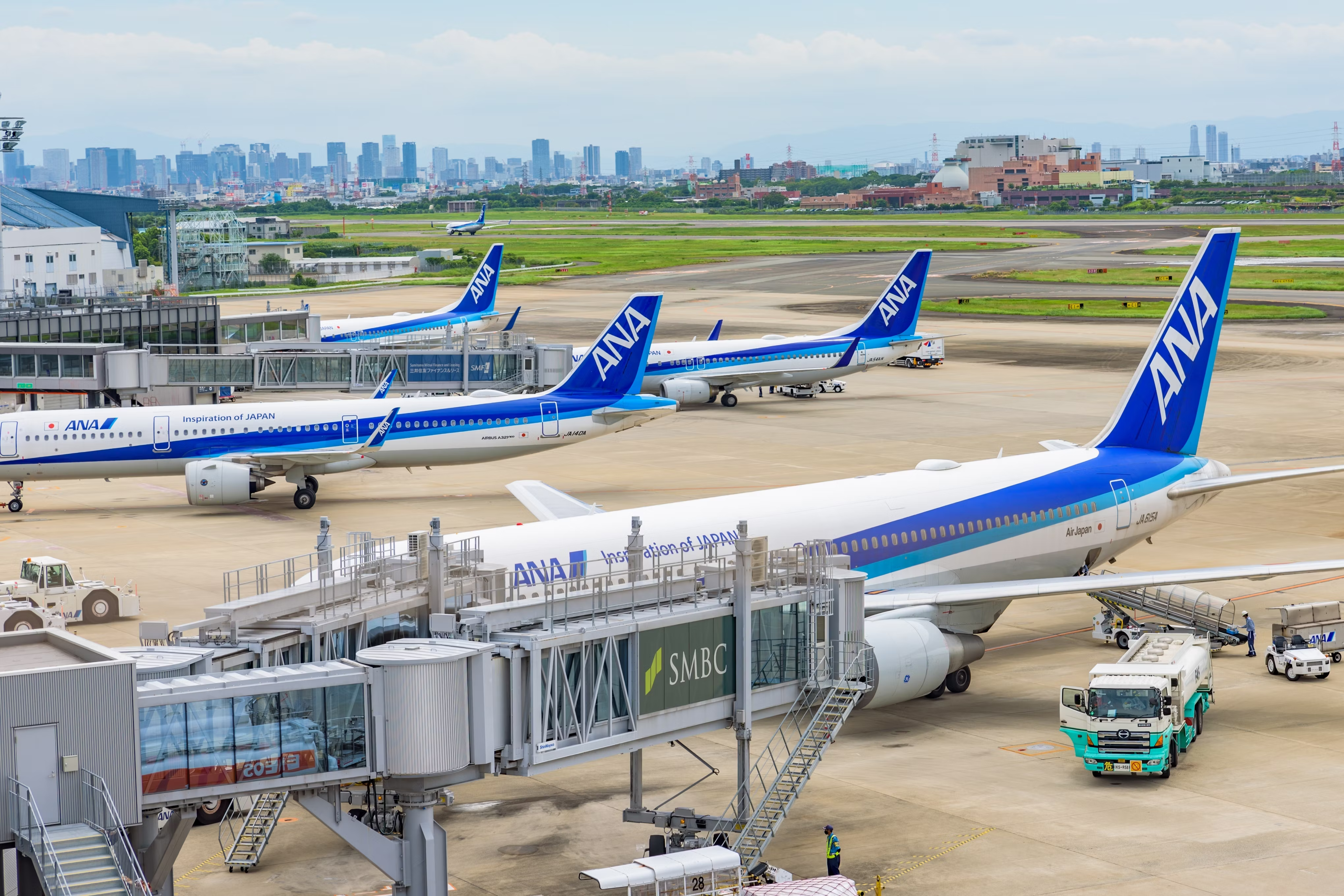 Several ANA aircraft parked on the apron at Itami Airport in Osaka.