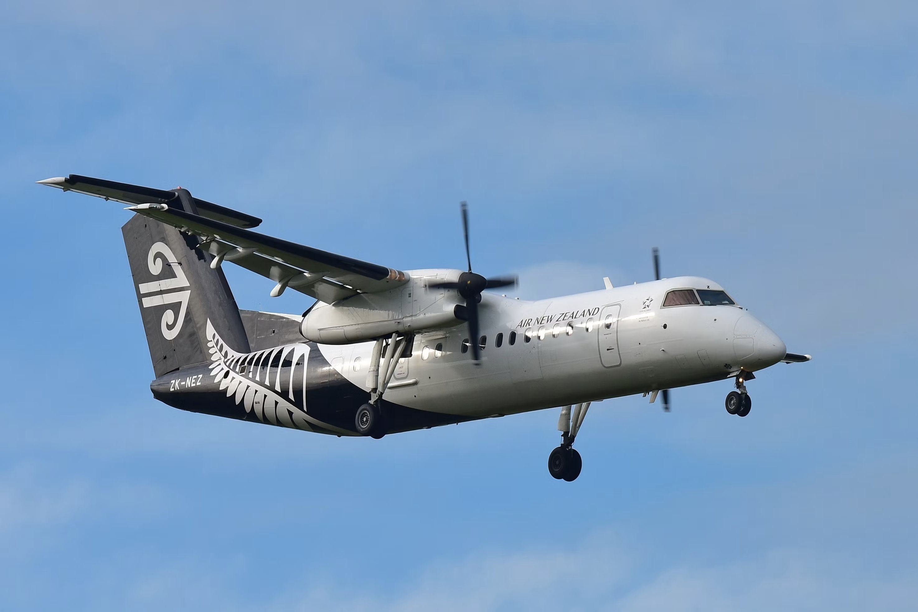 An Air New Zealand Bombardier Dash 8 Q300 flying in the sky.