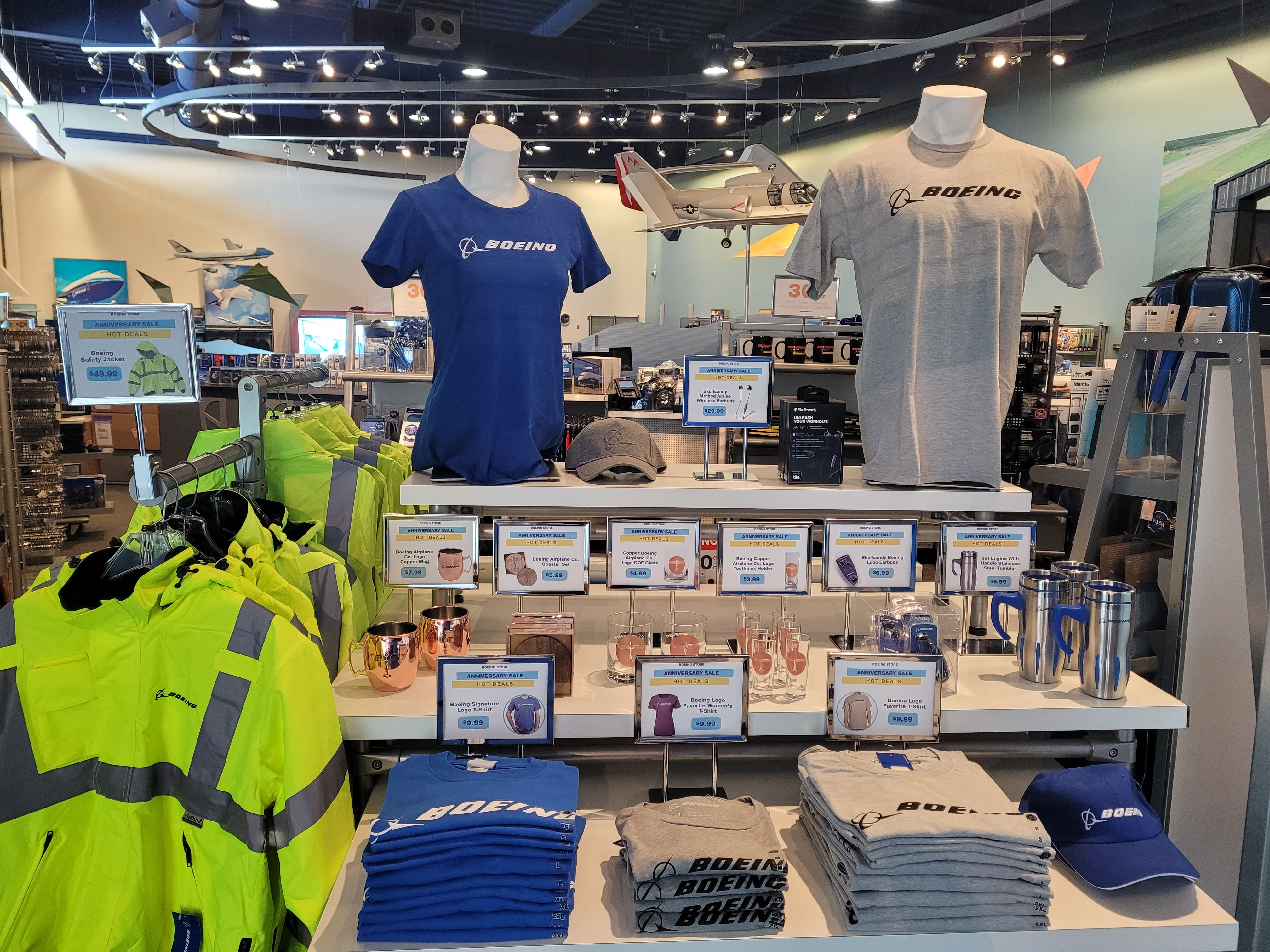 Several items of apparel for sale at the Boeing Store.