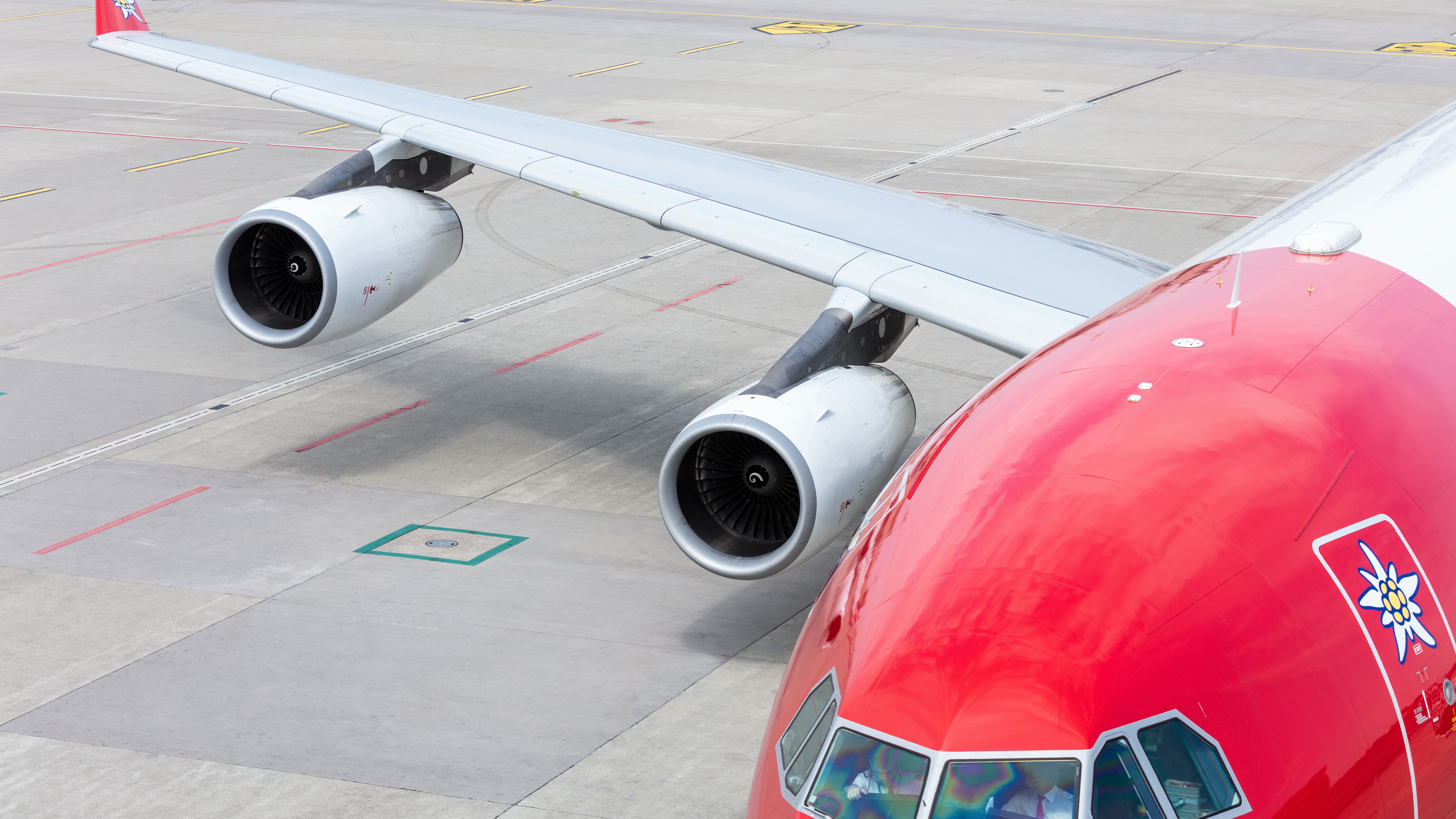 A closeup of two engines of an Edelweiss Airbus A340.