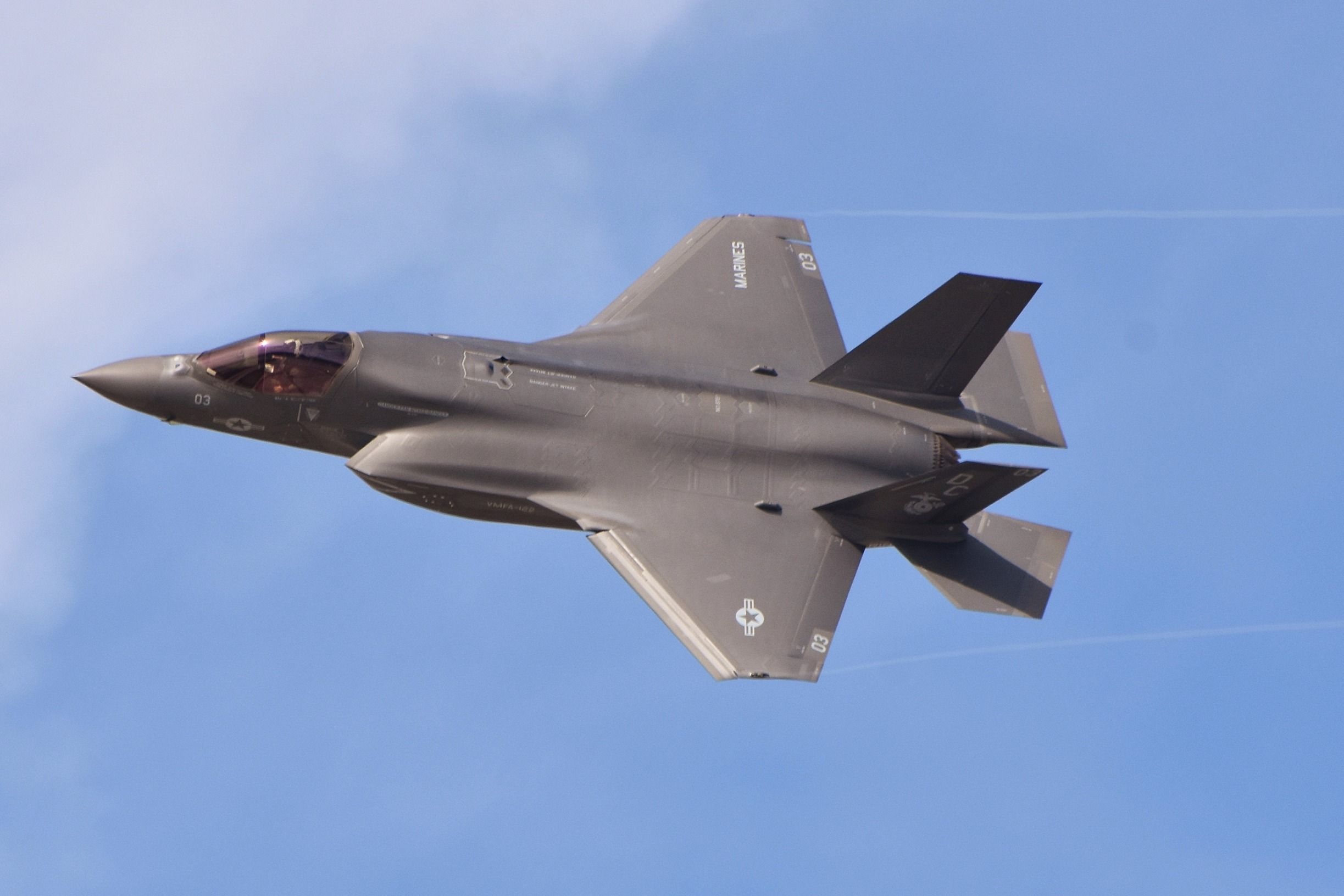 An F-35 flying in the sky.