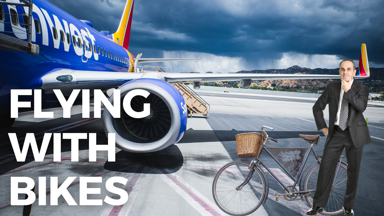 man with bike standing next to southwest airlines plane