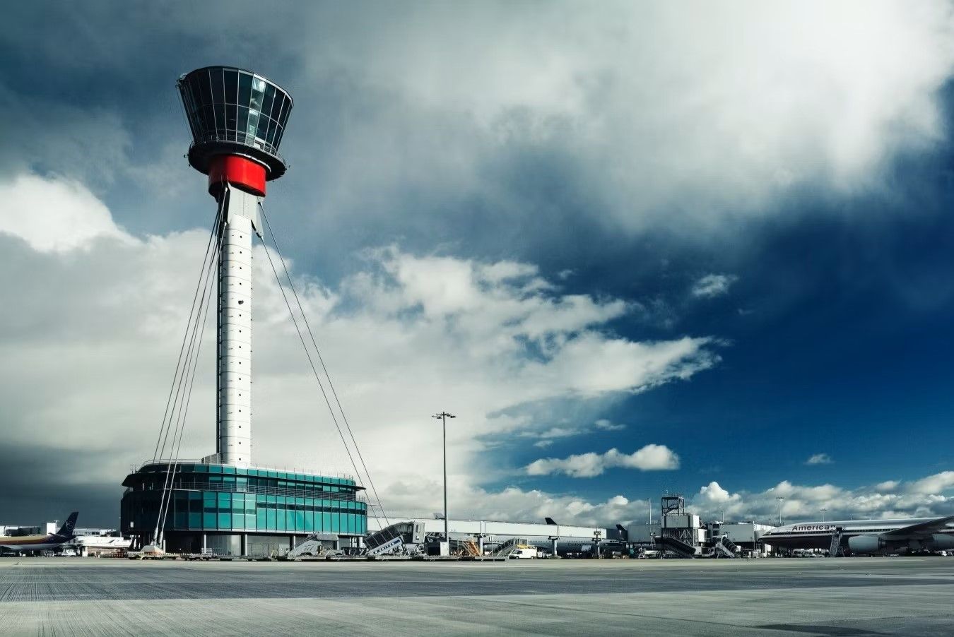 A panoramic photo of the apron and ATC tower at London Heathrow Airport.
