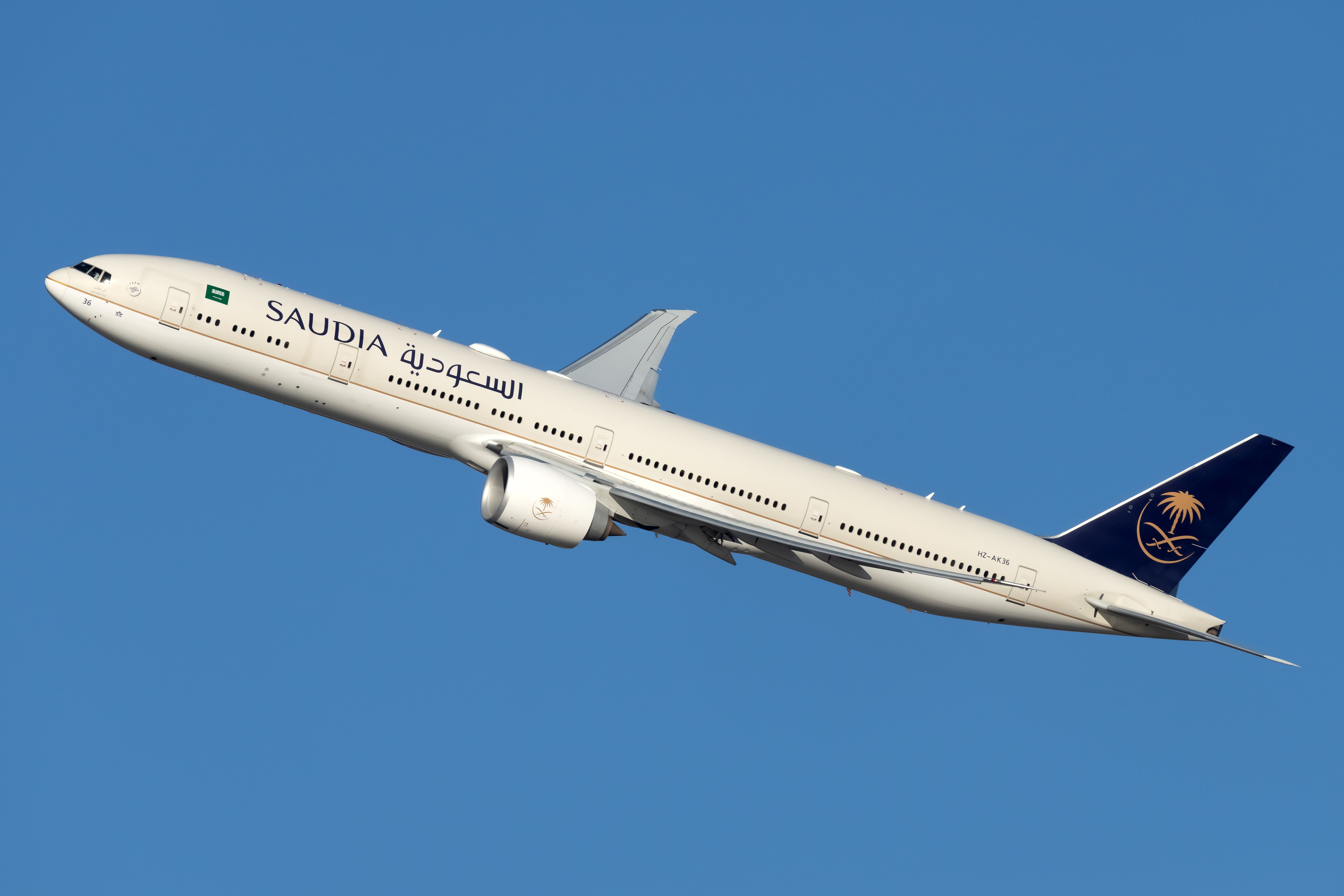 A Saudia Boeing 777-300ER Flying in the sky.