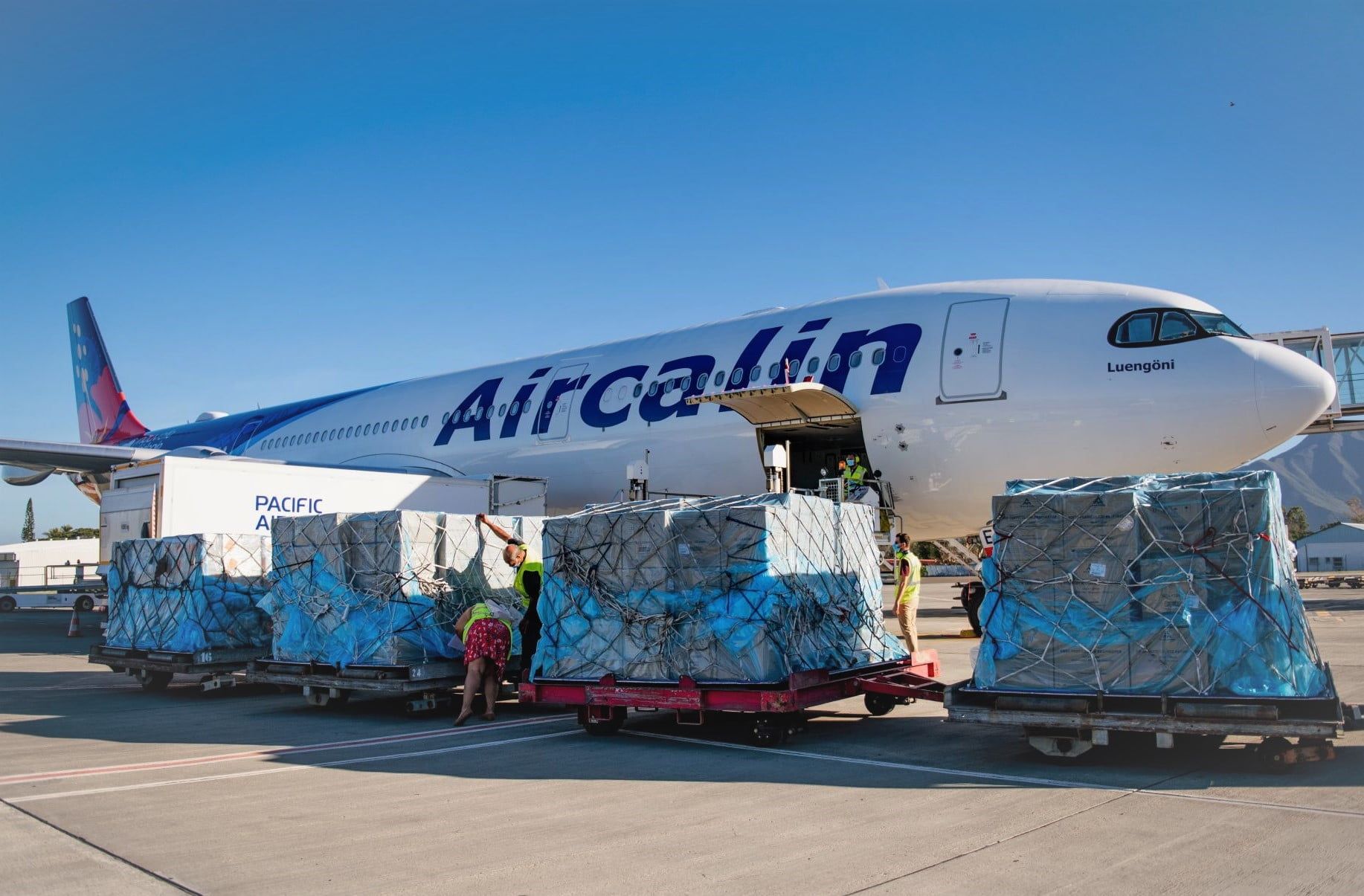 Aircalin Airbus A330-900 being loaded with freight on the ground.