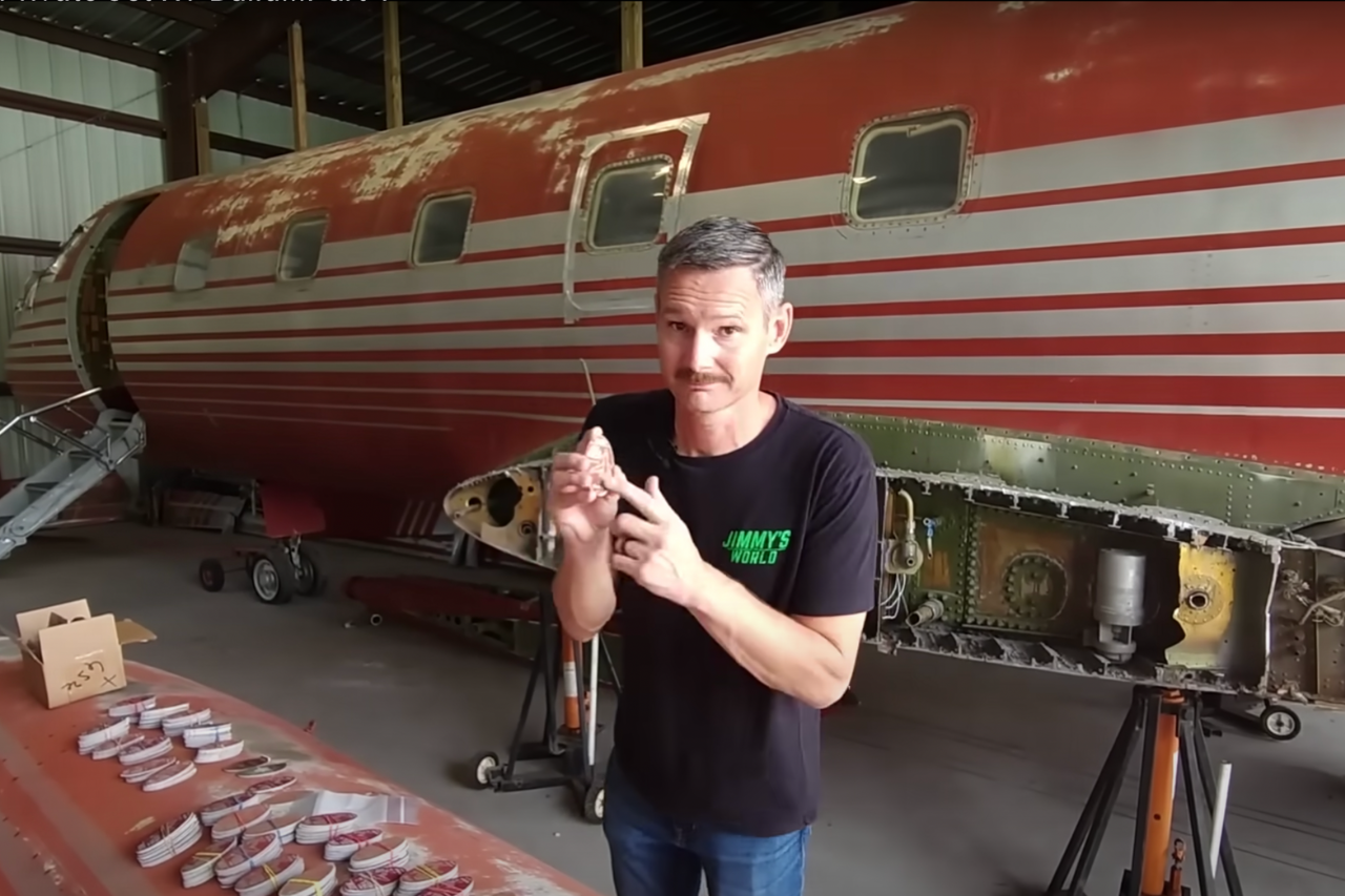 The Youtuber known as Jimmys World standing in front of Elvis's old JetStar aircraft.