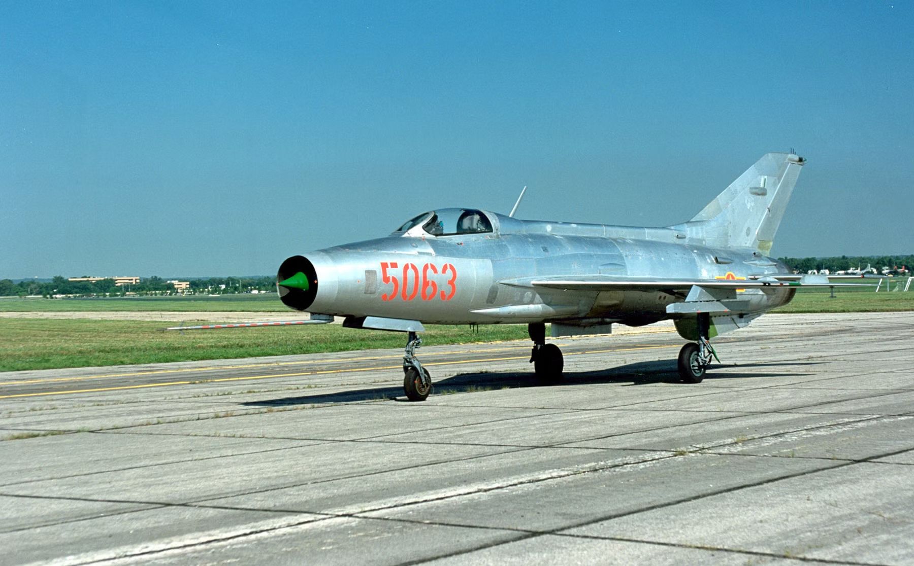 A MiG-21 on an airport apron.