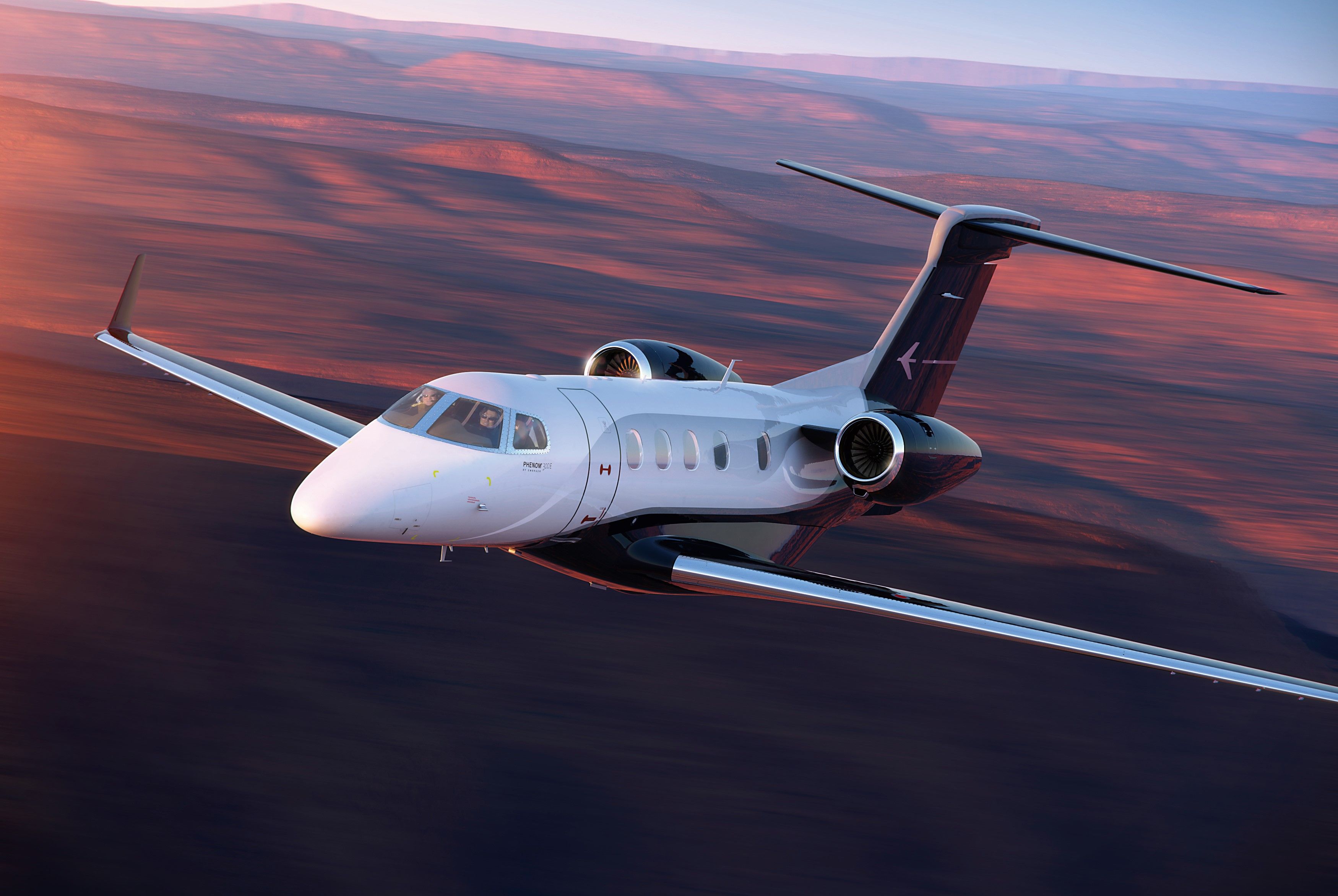 Phenom-300E Exterior Flight Sunset