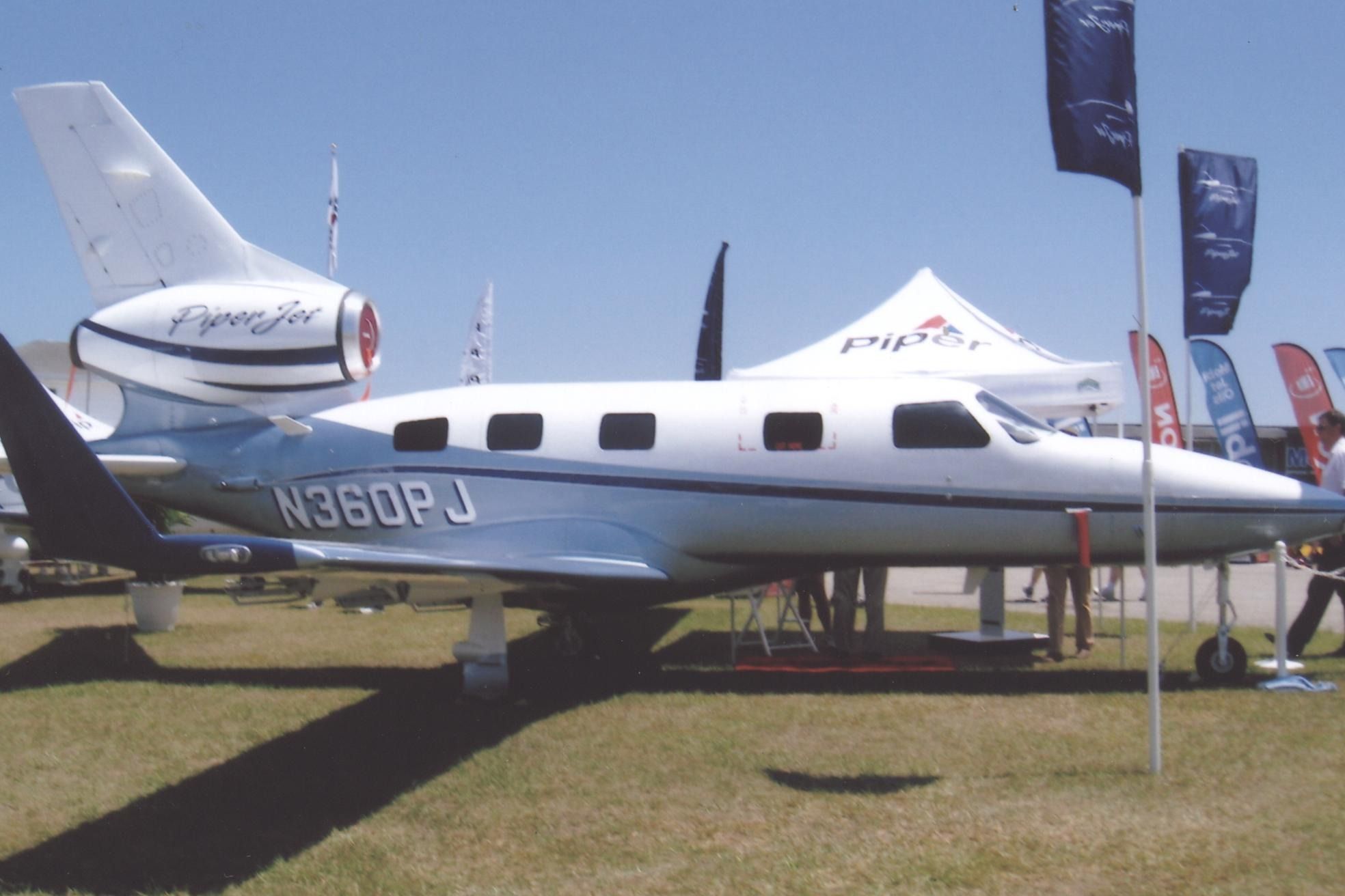A Piper PA-47 on display at an airshow.