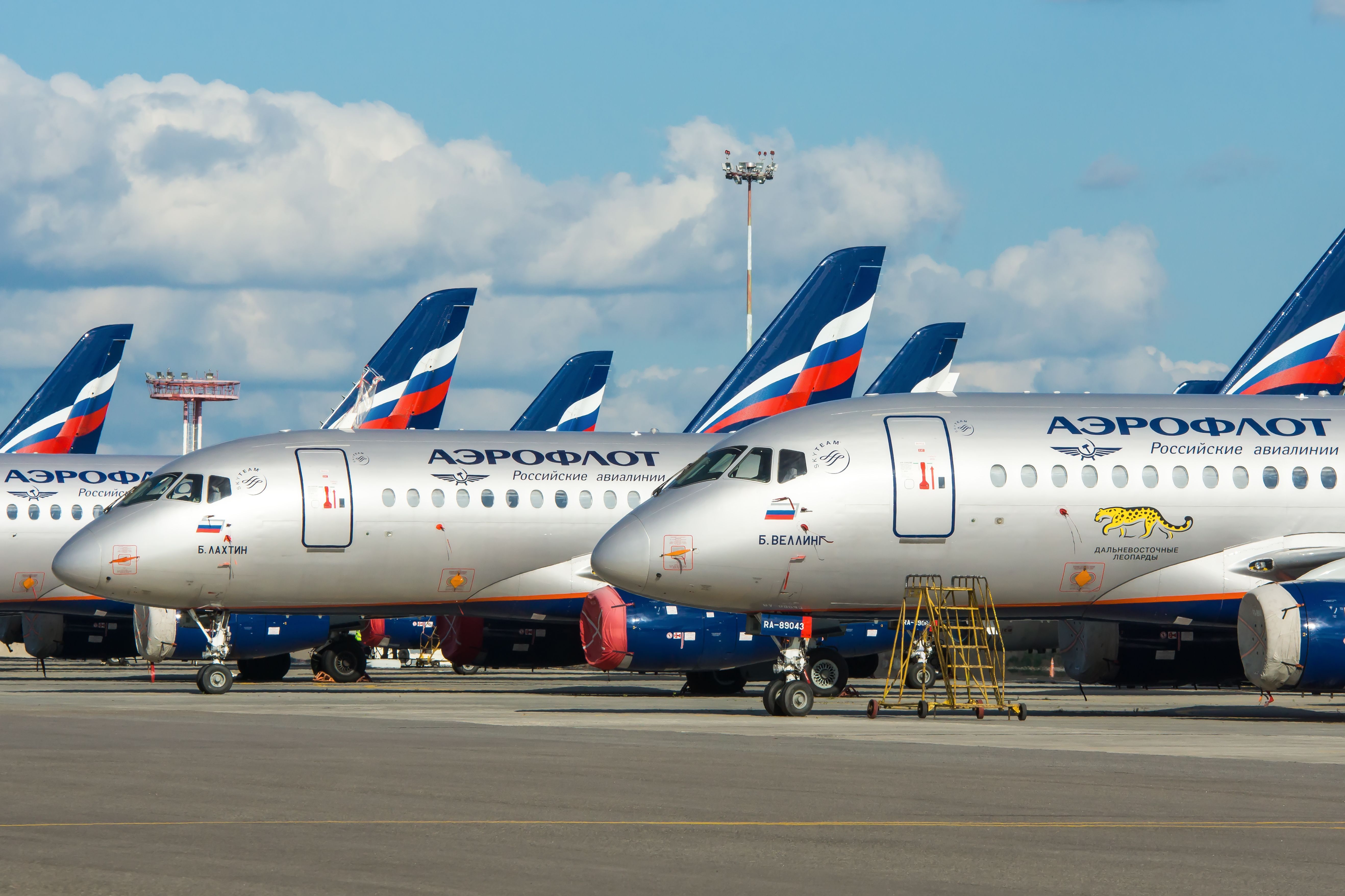 Several Aeroflot Sukhoi Superjet 100s parked side by side.