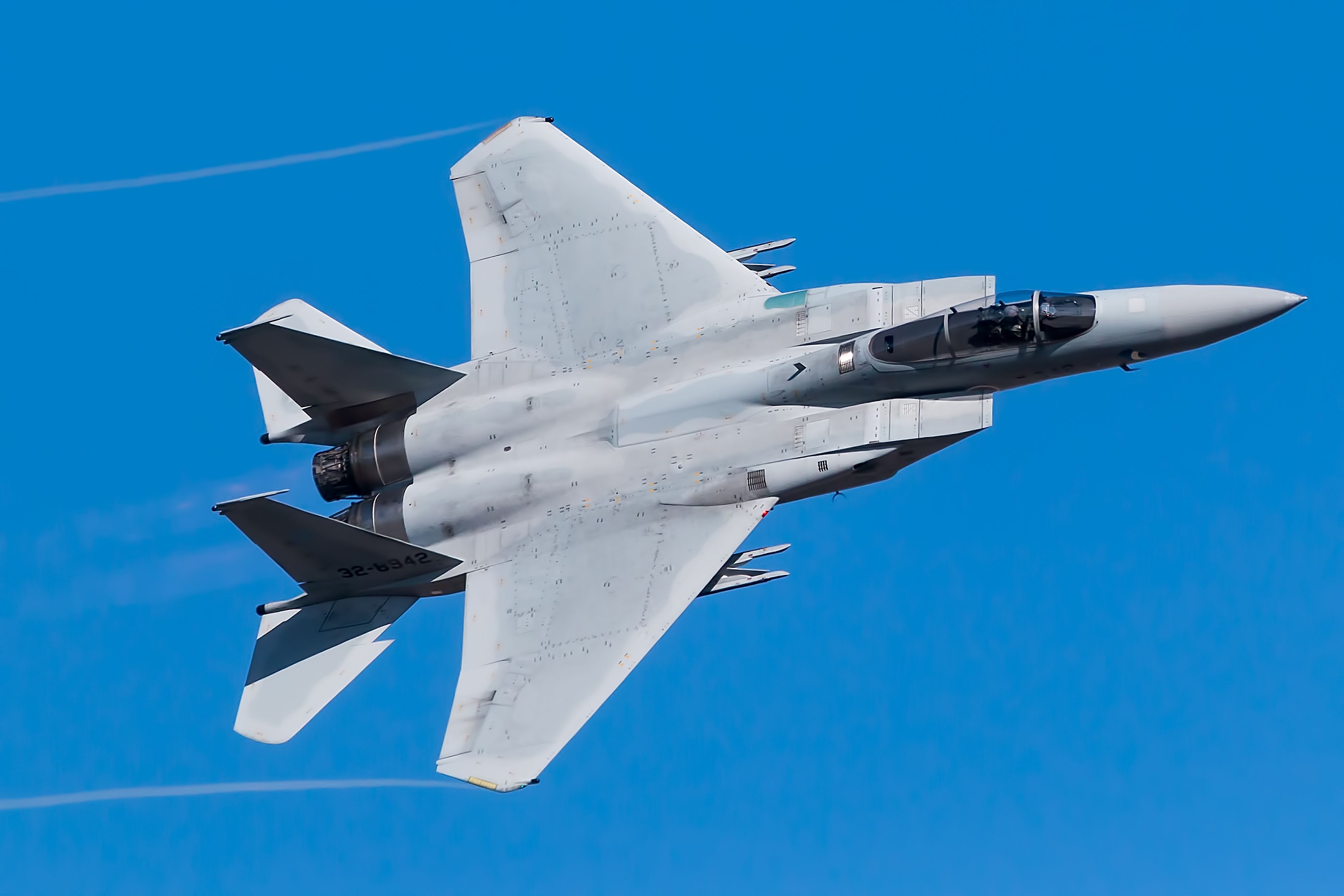 An F-15 Flying in the sky.