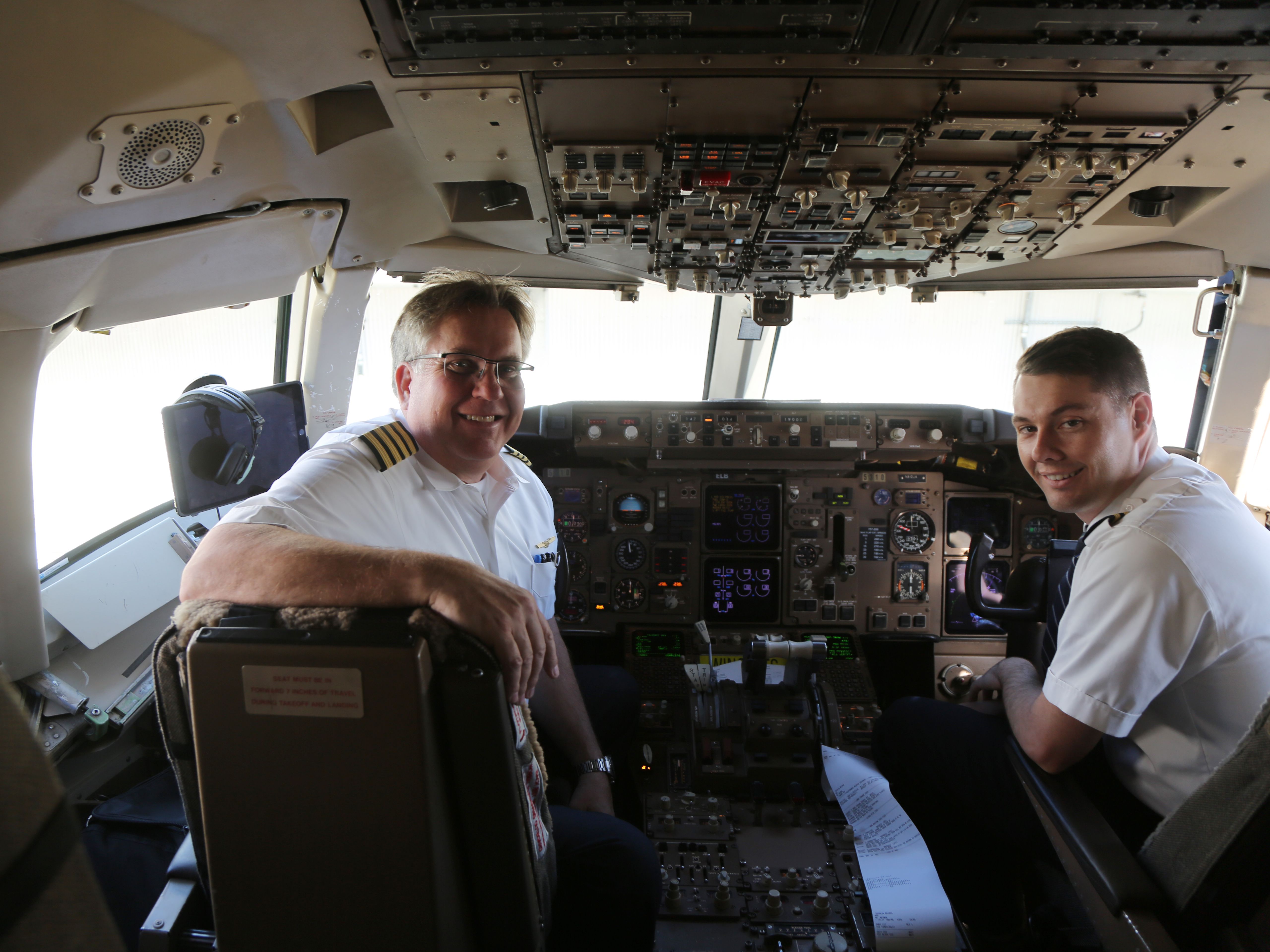 shutterstock_1315749092 - AUCKLAND, NEW ZEALAND - FEBRUARY 5, 2019: United Airlines pilots at cockpit before transpacific flight to San Francisco in Auckland International Airport, New Zealand