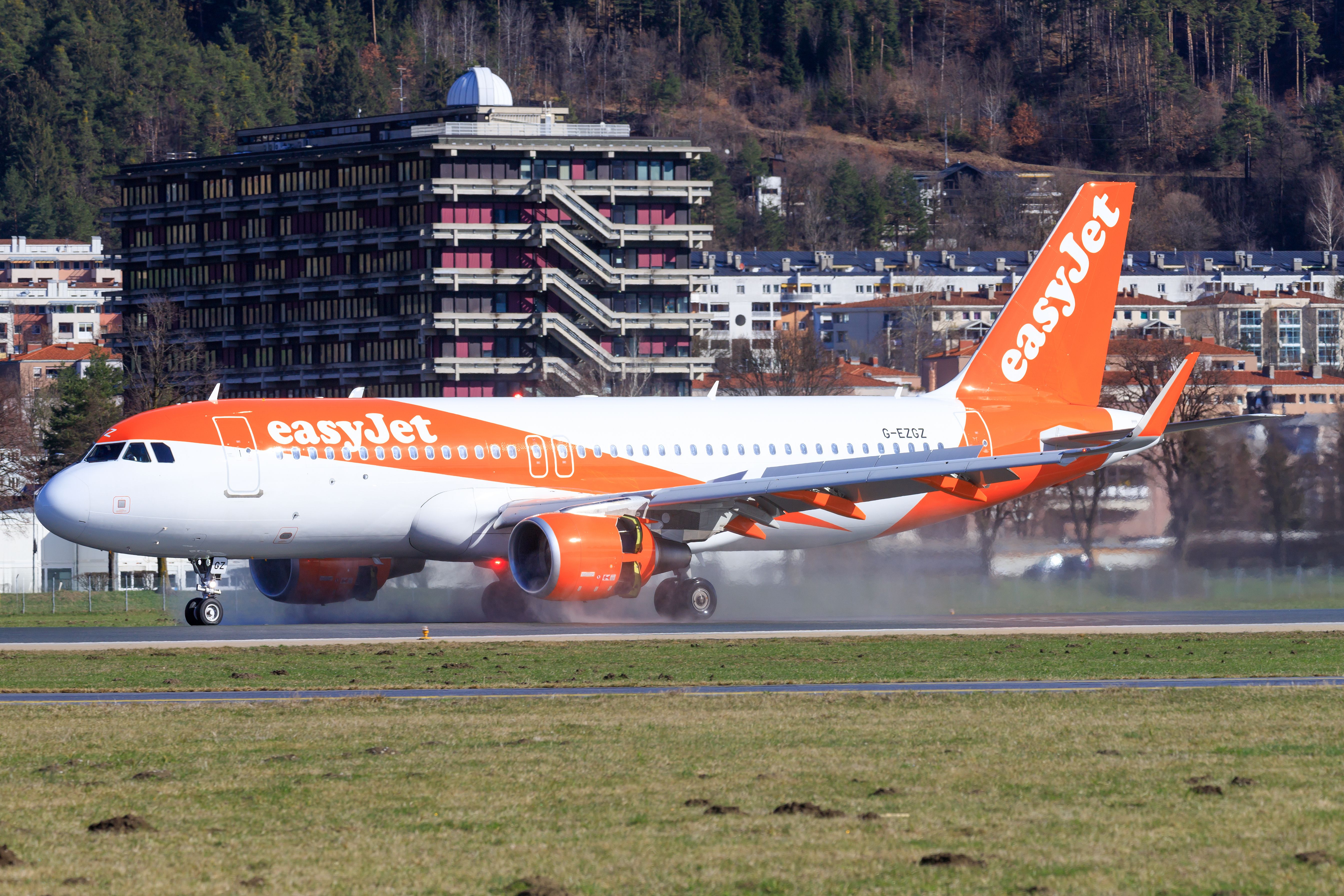 An easyJet Airbus A320 on an airport apron.