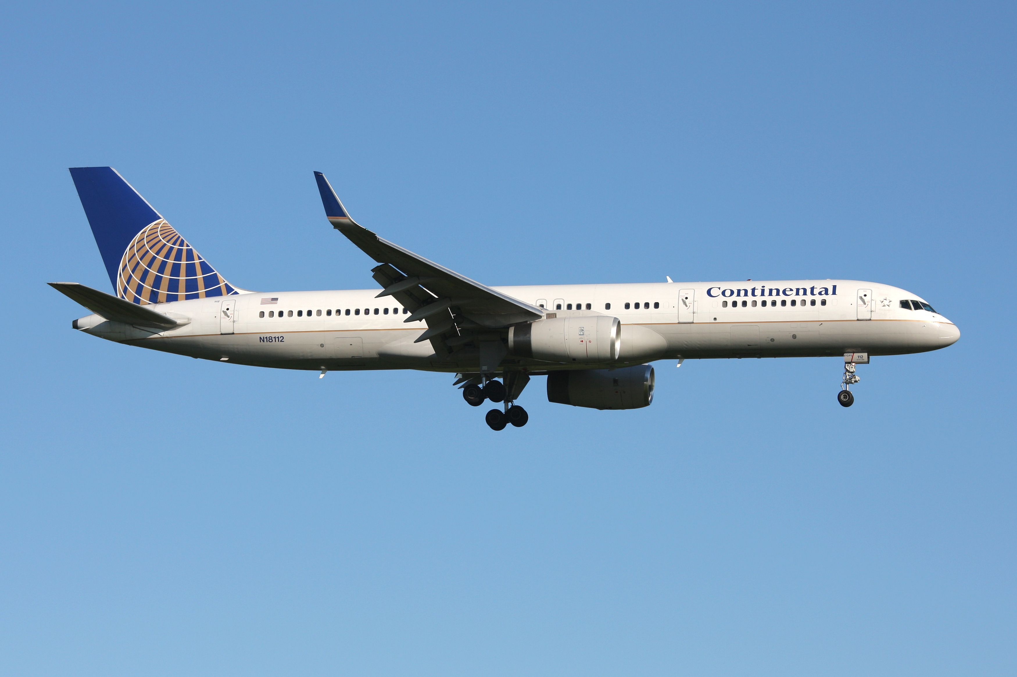 A Continental Airlines Boeing 757-200 Flying In The Sky.