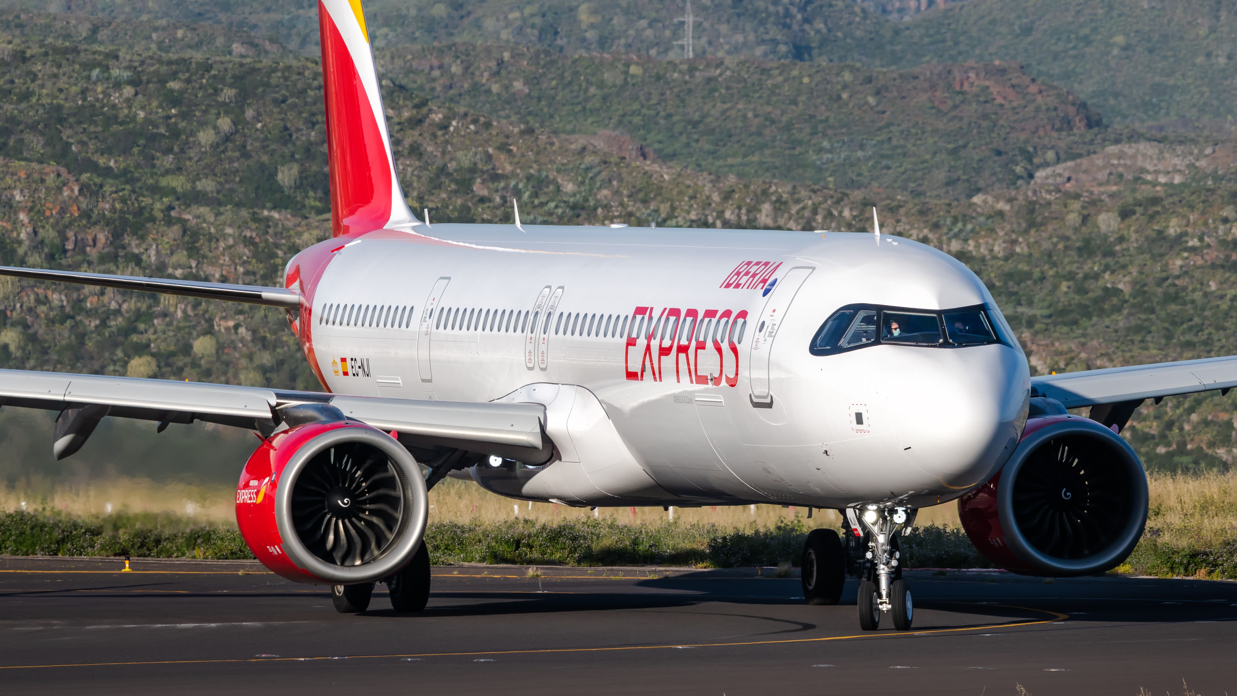 An Iberia Express Airbus A321neo on an airport apron.
