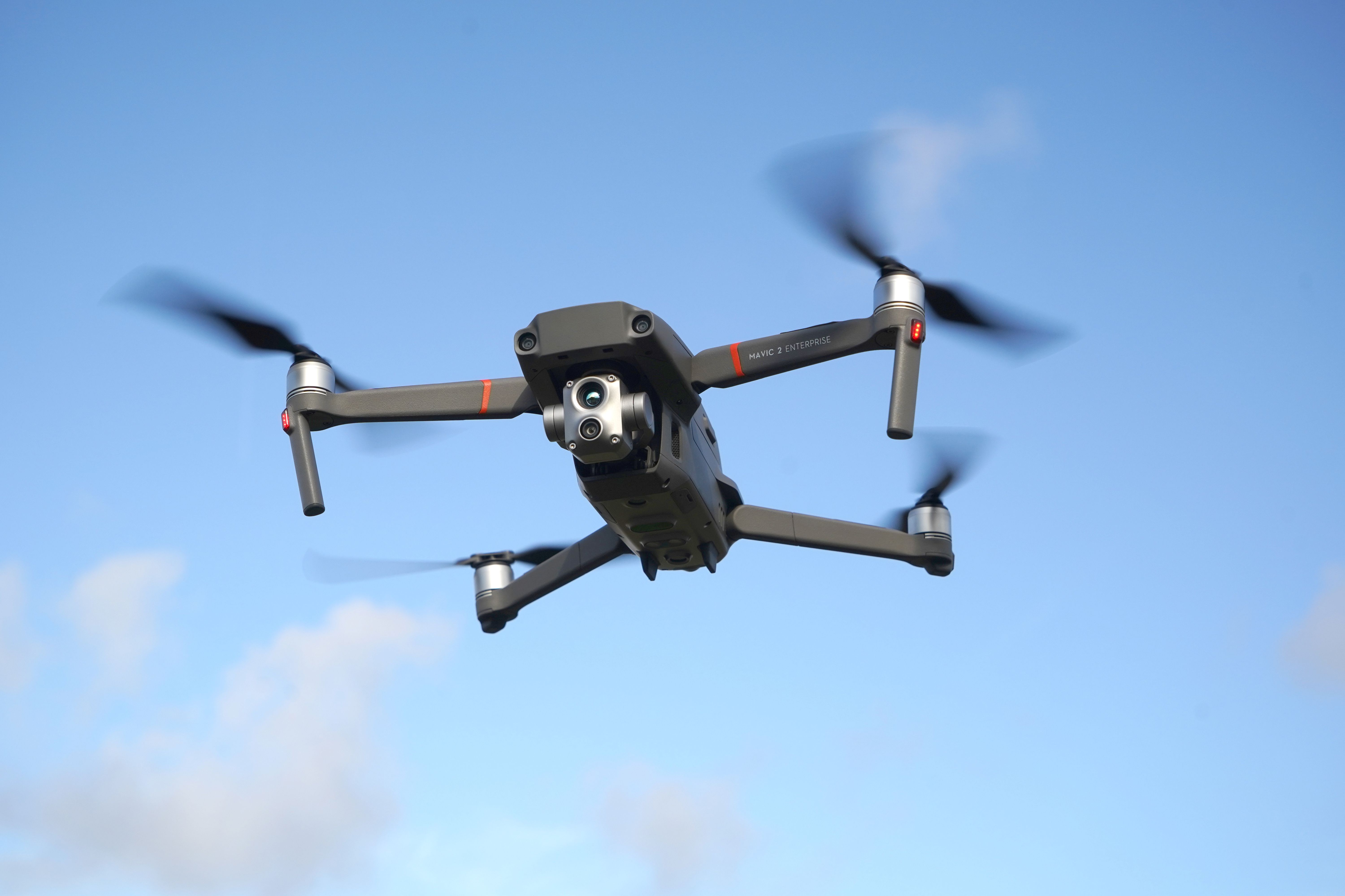 A police drone flying in the sky.