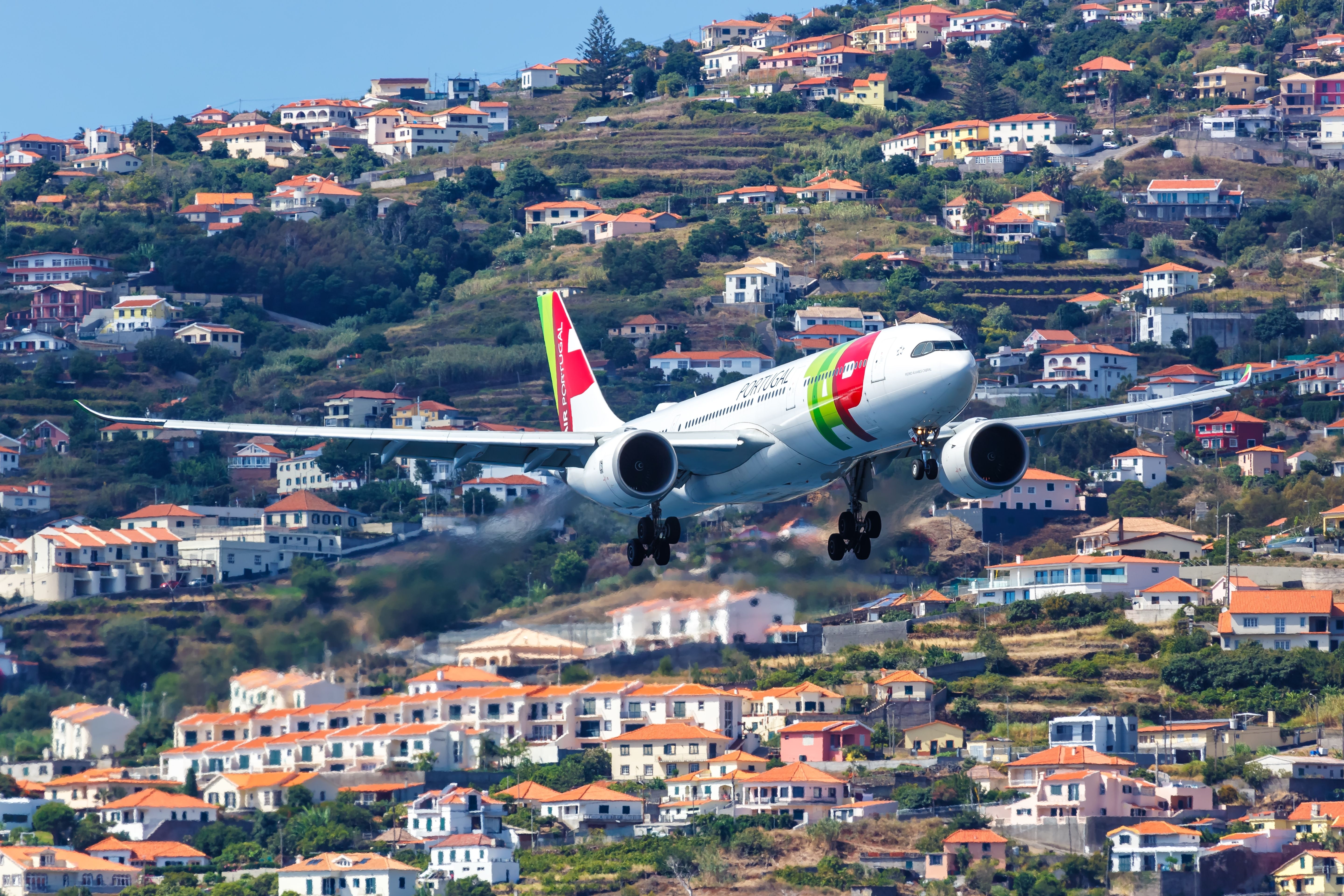 A TAP Air Portugal Airbus A330neo Flying low to the ground.