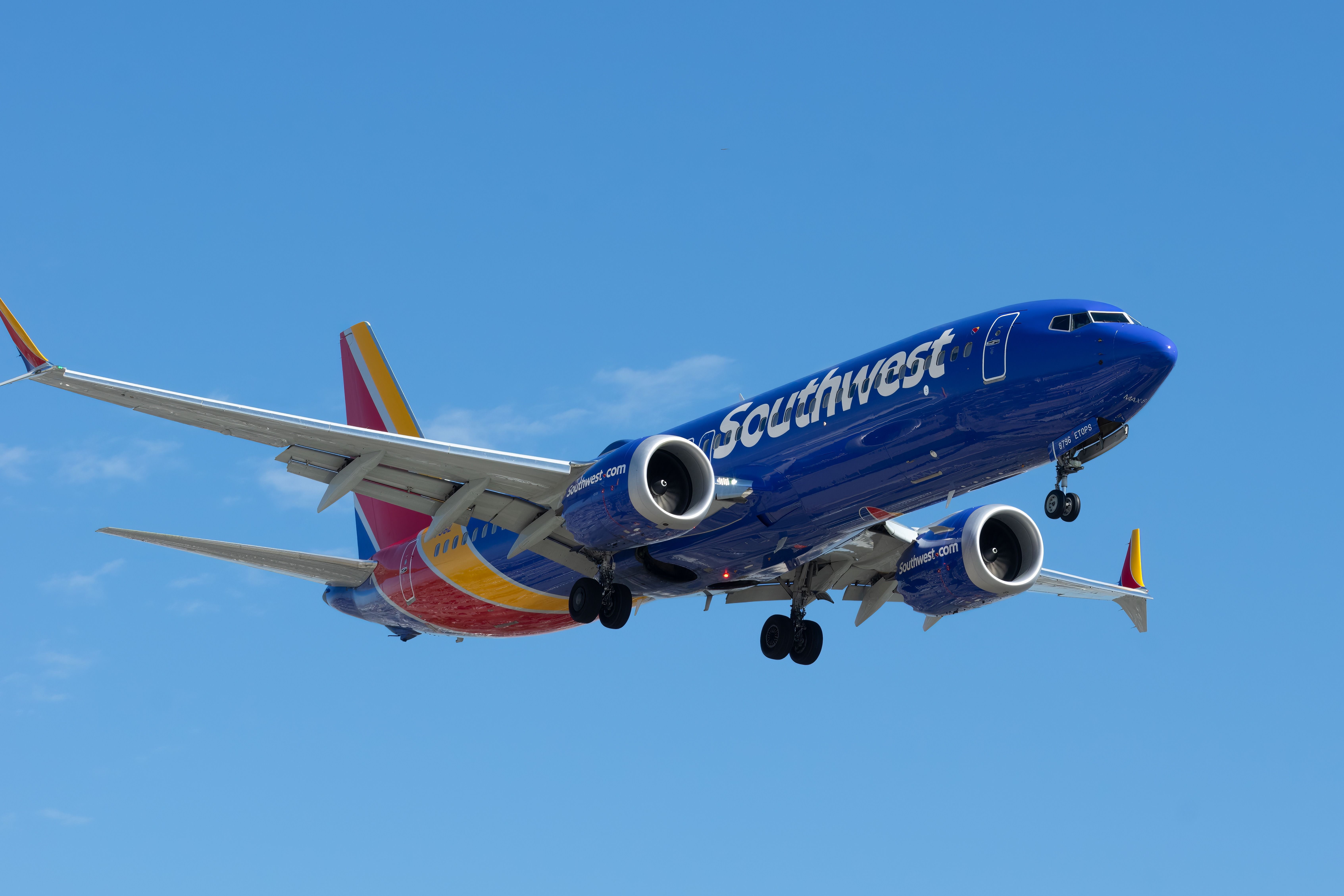 A Southwest Airlines Boeing 737 MAX 8 flying in the sky.