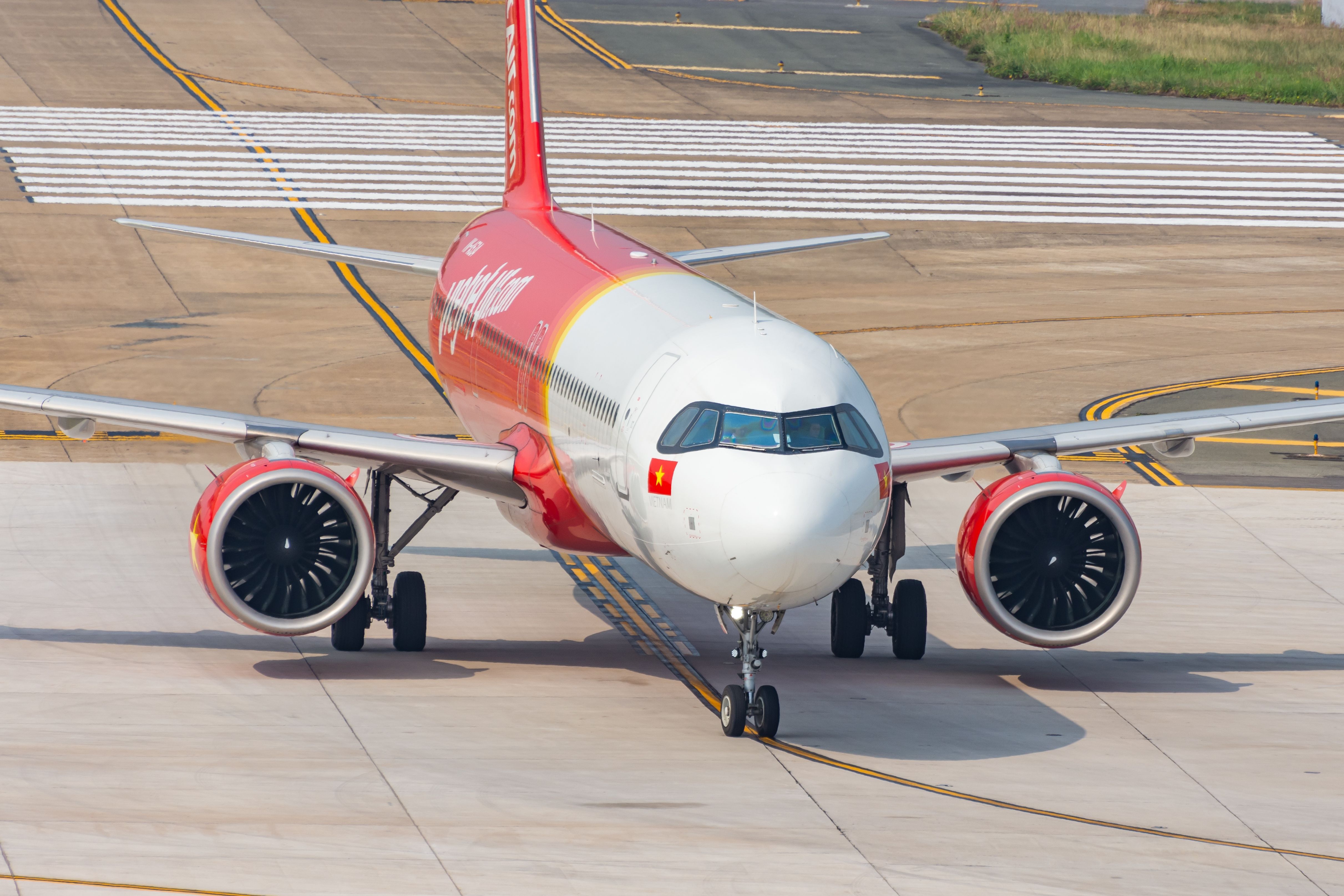 A VietJet Airbus A321neo aircraft on an airport apron.