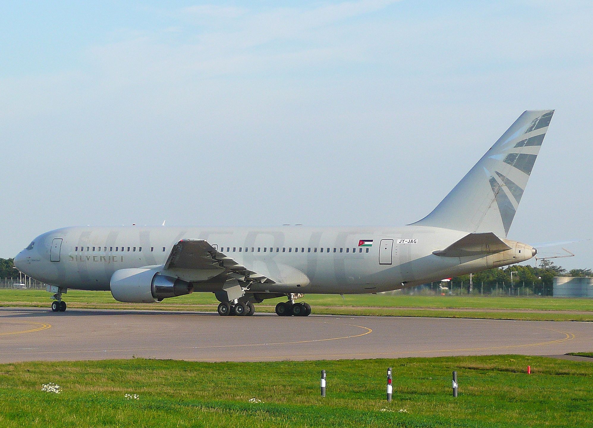 A Silverjet Boeing 767-200 on an airport apron.