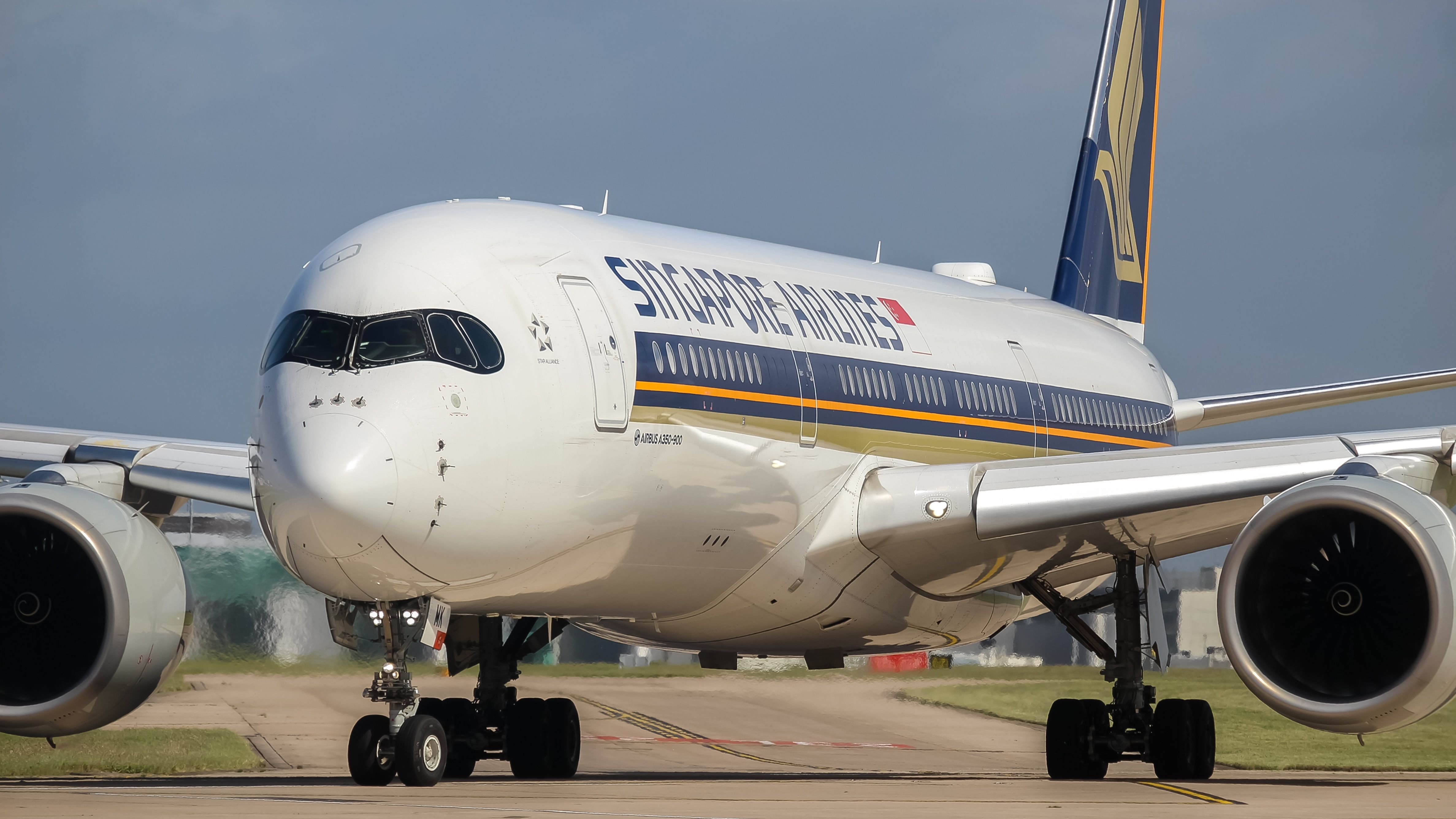 A Singapore Airlines Airbus A350-900 on an airport apron.