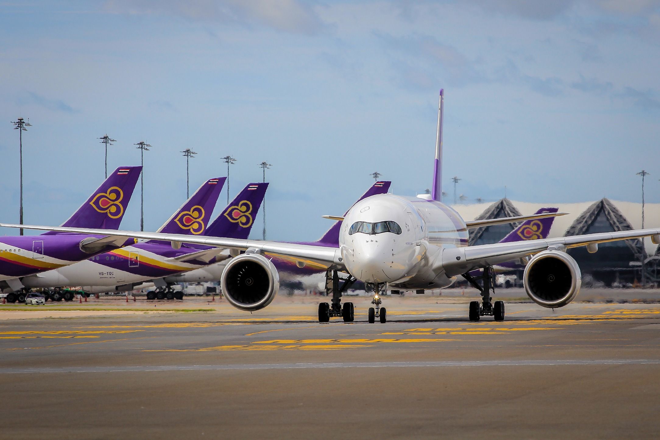 Thai Airways Airbus A350 with other Thai Airways aircraft in the background