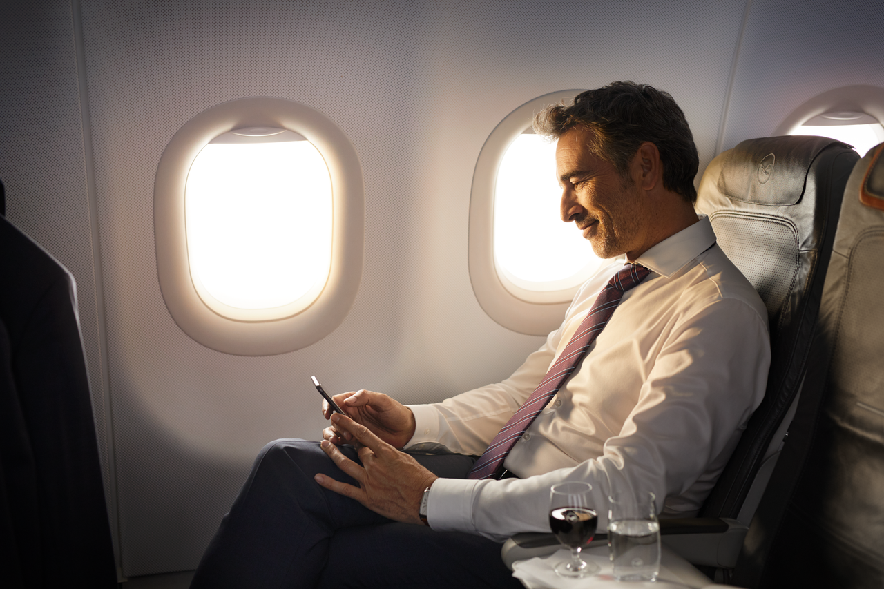 A man uses Lufthansa's WiFi in business class on an Airbus A320 flight.