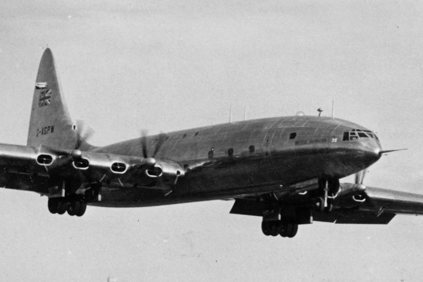 A black and white photo of the Bristol Brabazon flying in the sky.