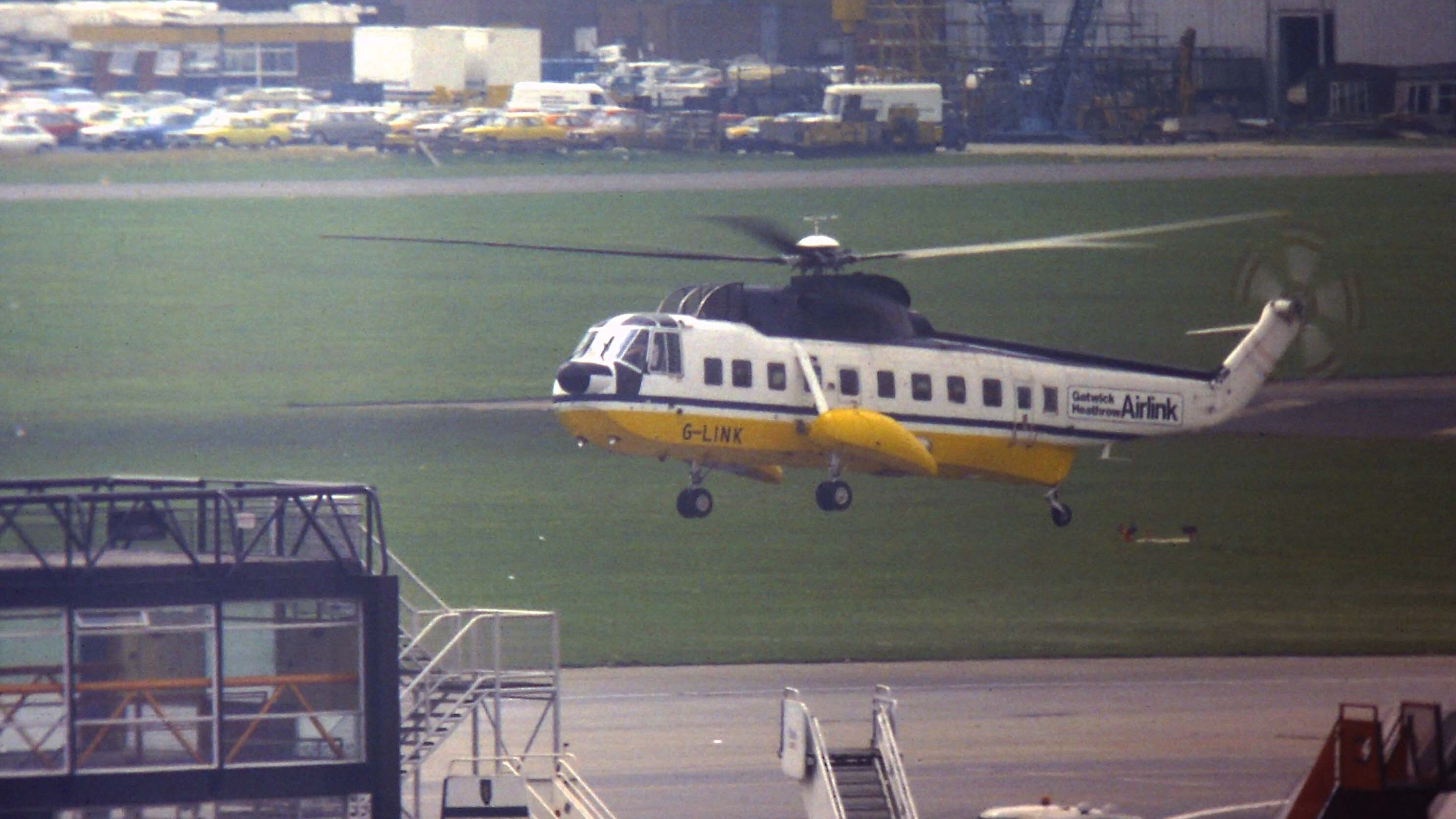 Gatwick - Heathrow's 'Airlink' shuttle in the form of Sikorsky S-61N G-LINK caught arriving by the old South Pier at Gatwick sometime in the mid 1980's.   