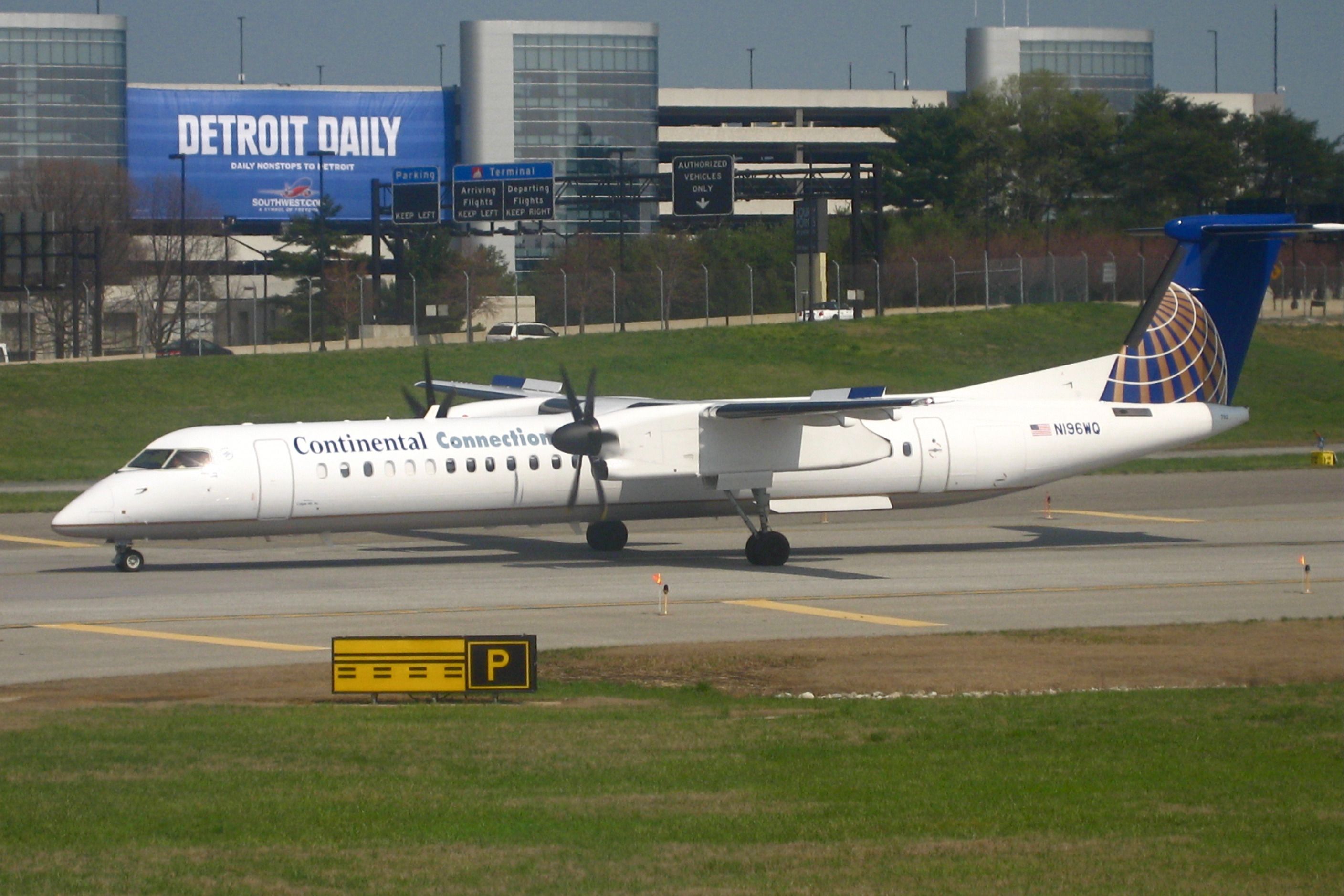 A Continental Connection Bombardier Dash 8 Q400 on an airport apron. 