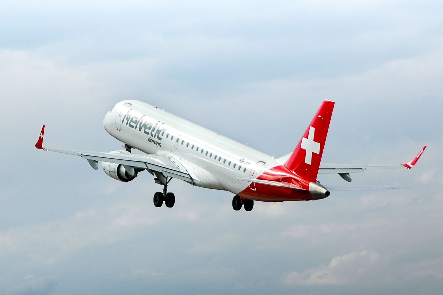 Helvetic Airways Embraer E190 taking off. 
