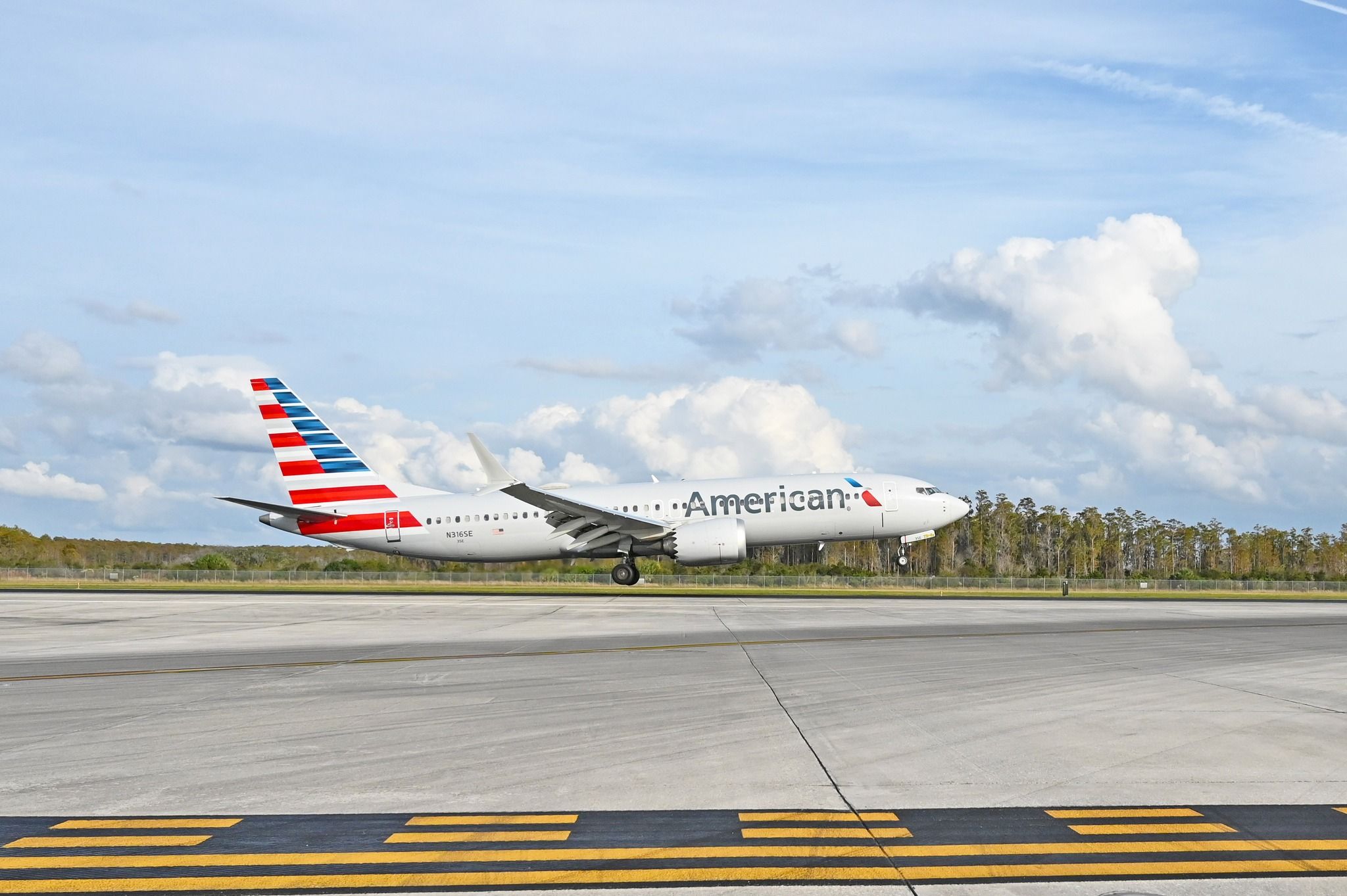 American Airlines Boeing 737 MAX 8 taking off from Orlando International Airport.