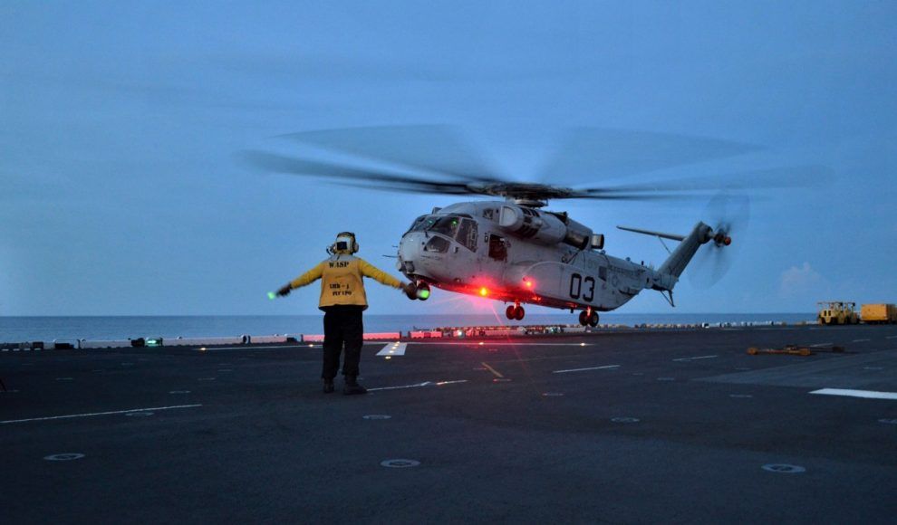 A Sikorsky CH-53K King Stallion landing on a ship.