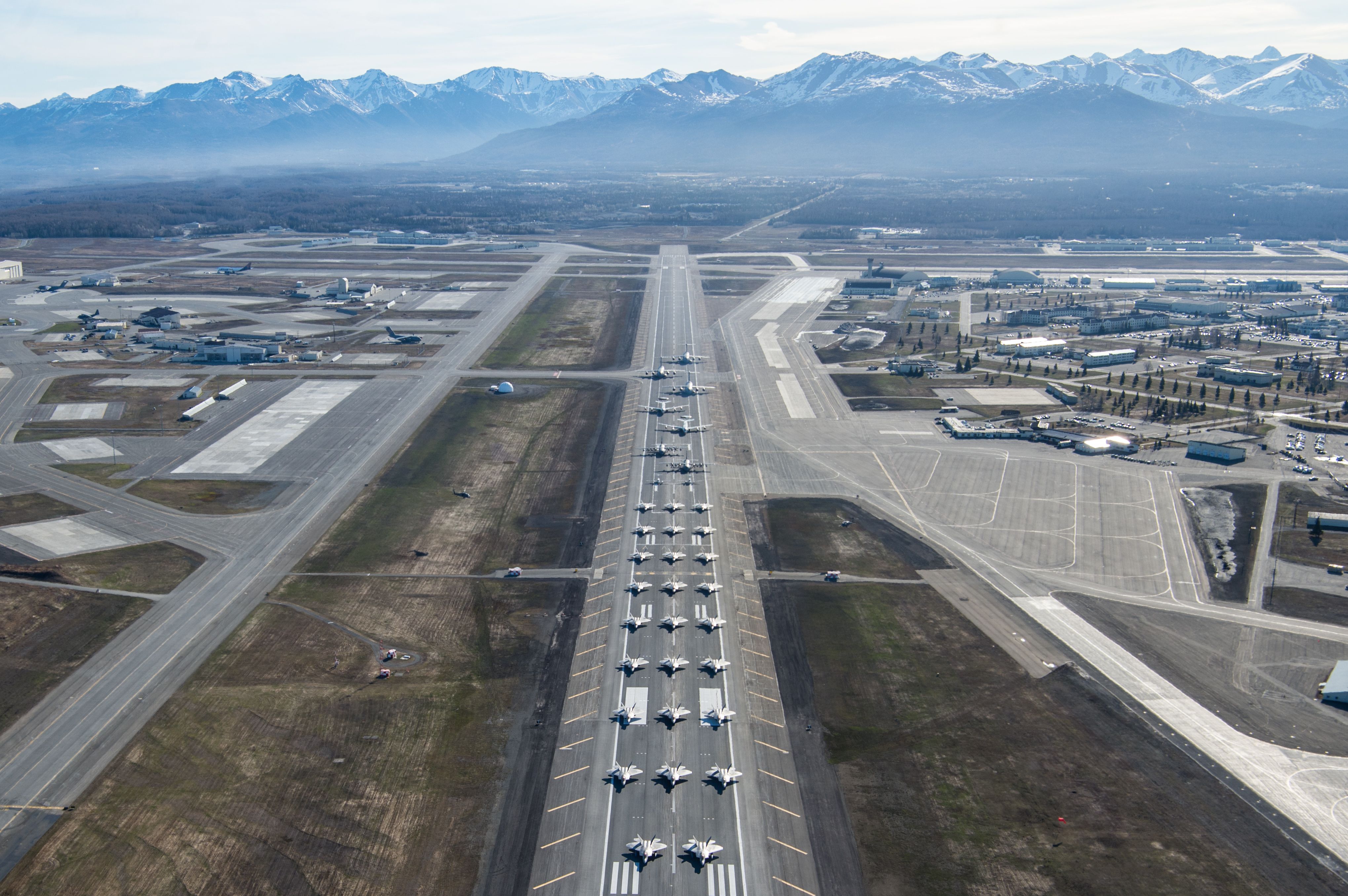 Several types of military aircraft during an elephant walk at JBER in Alaska.