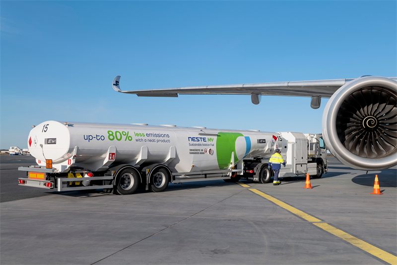 A Neste Tanker on an airport apron providing SAF Sustainable Aviation Fuel.