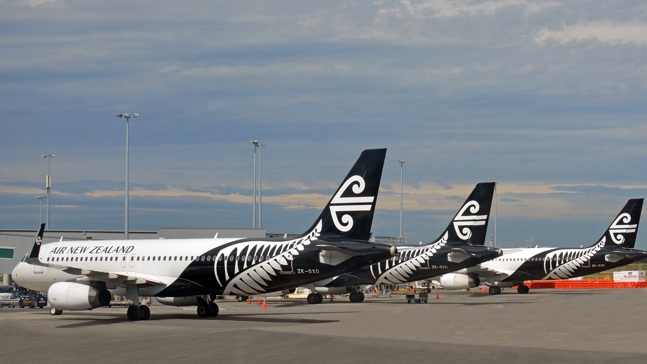 Three Air New Zealand aircraft parked on the apron at Christchurch Airport.
