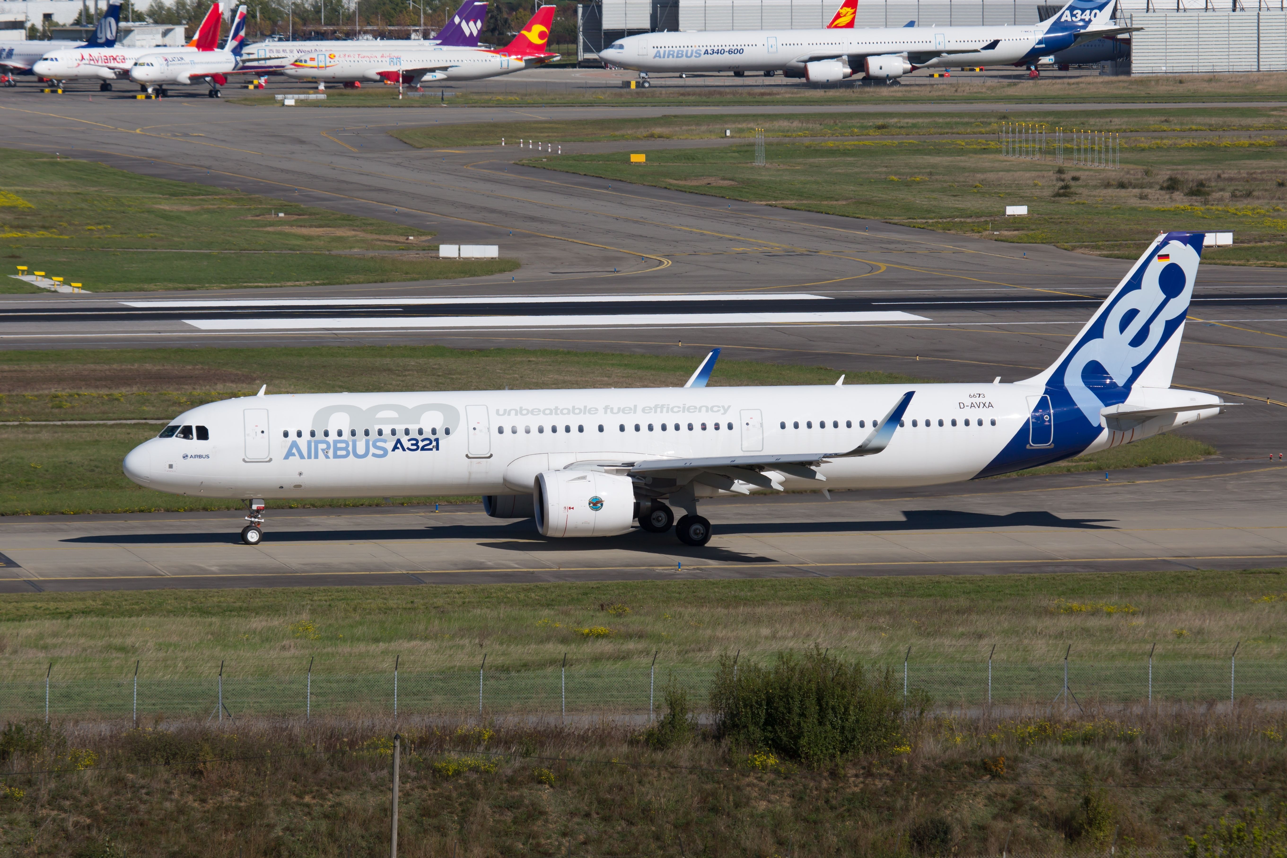 An Airbus A321neo in its test livery on the apron at Toulouse Blagnac Airport.